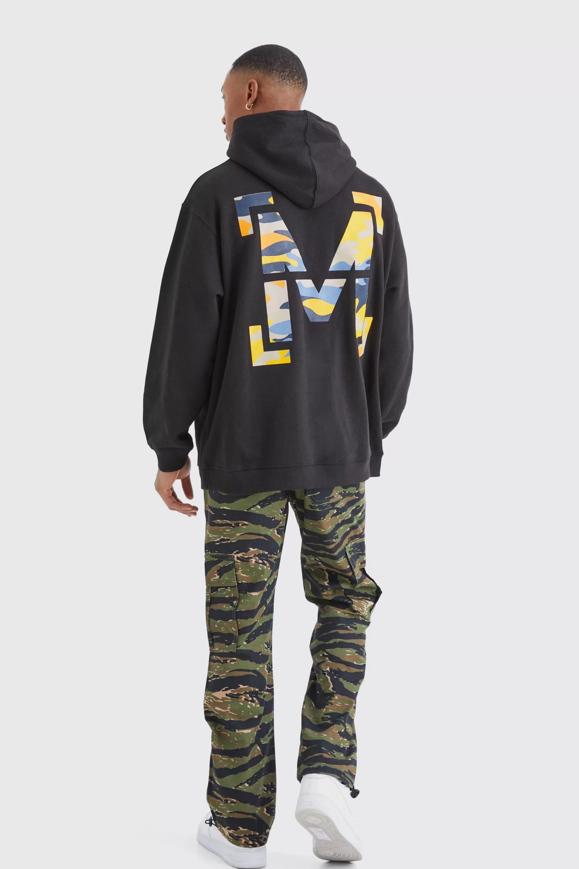 boohooMAN Oversized M Camo Graphic Hoodie | UK