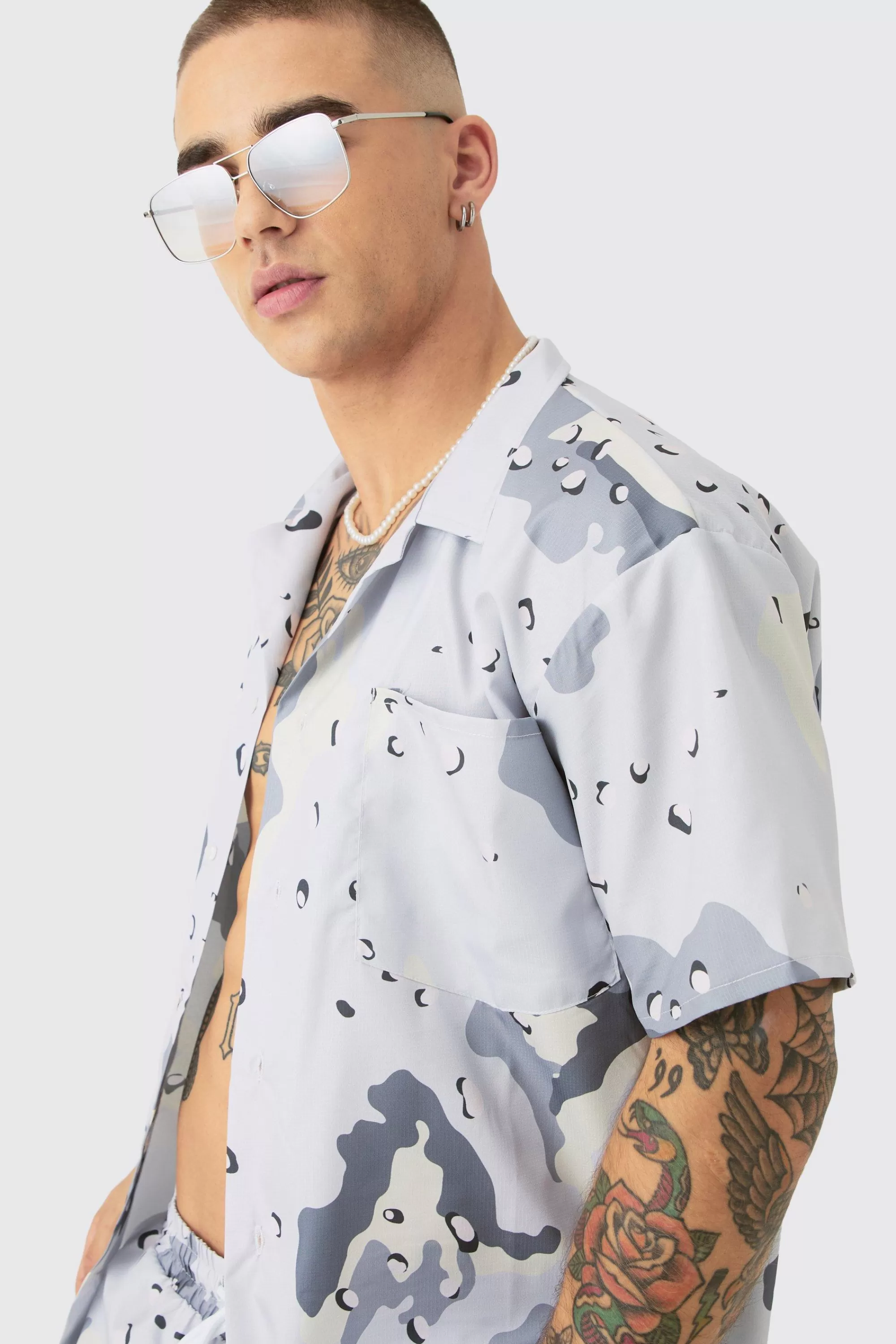 boohooMAN Oversized Ripstop Camo Shirt & Short Swim Short Set | UK
