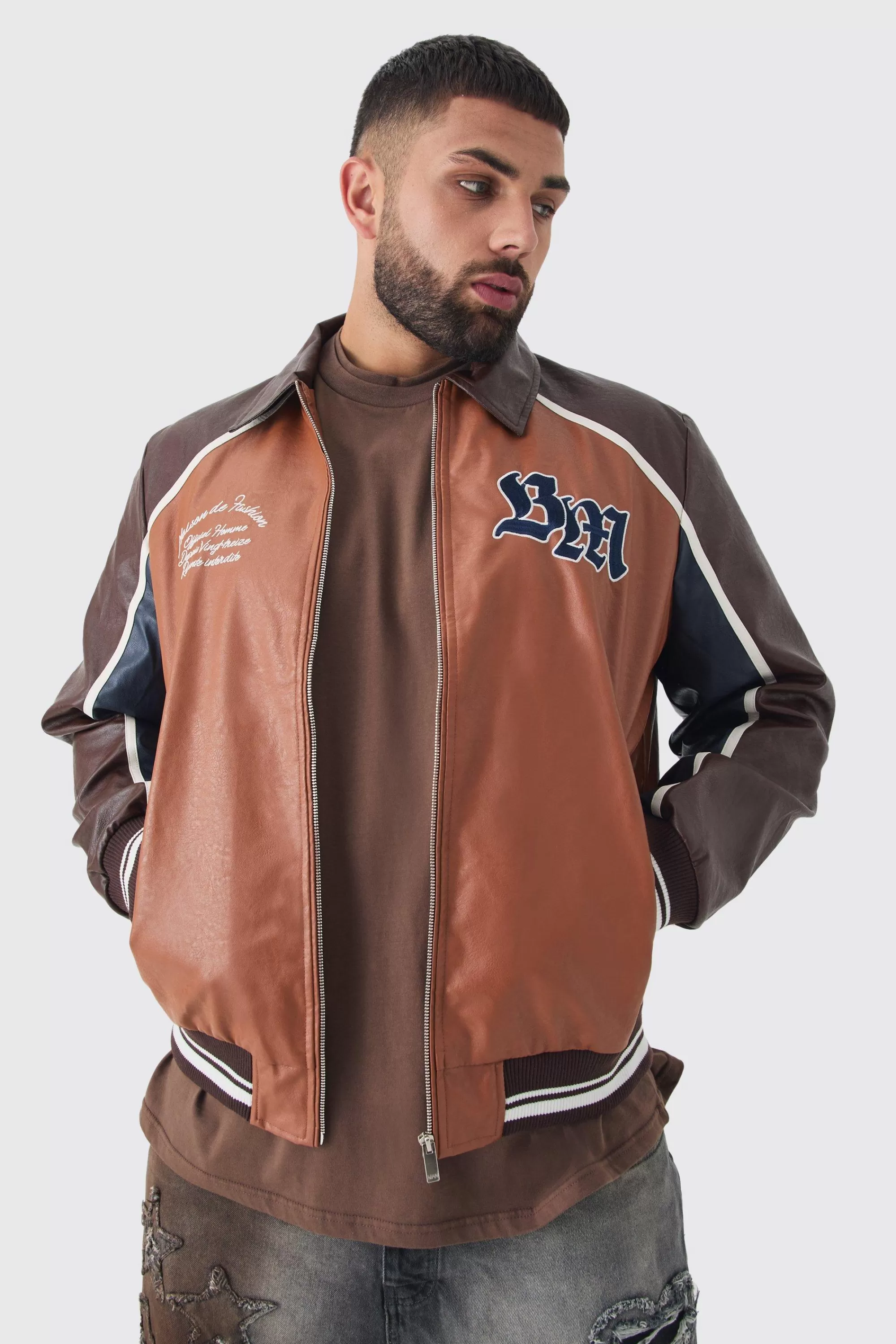 boohooMAN Plus BM Badge Collared PU Varsity Jacket In | UK