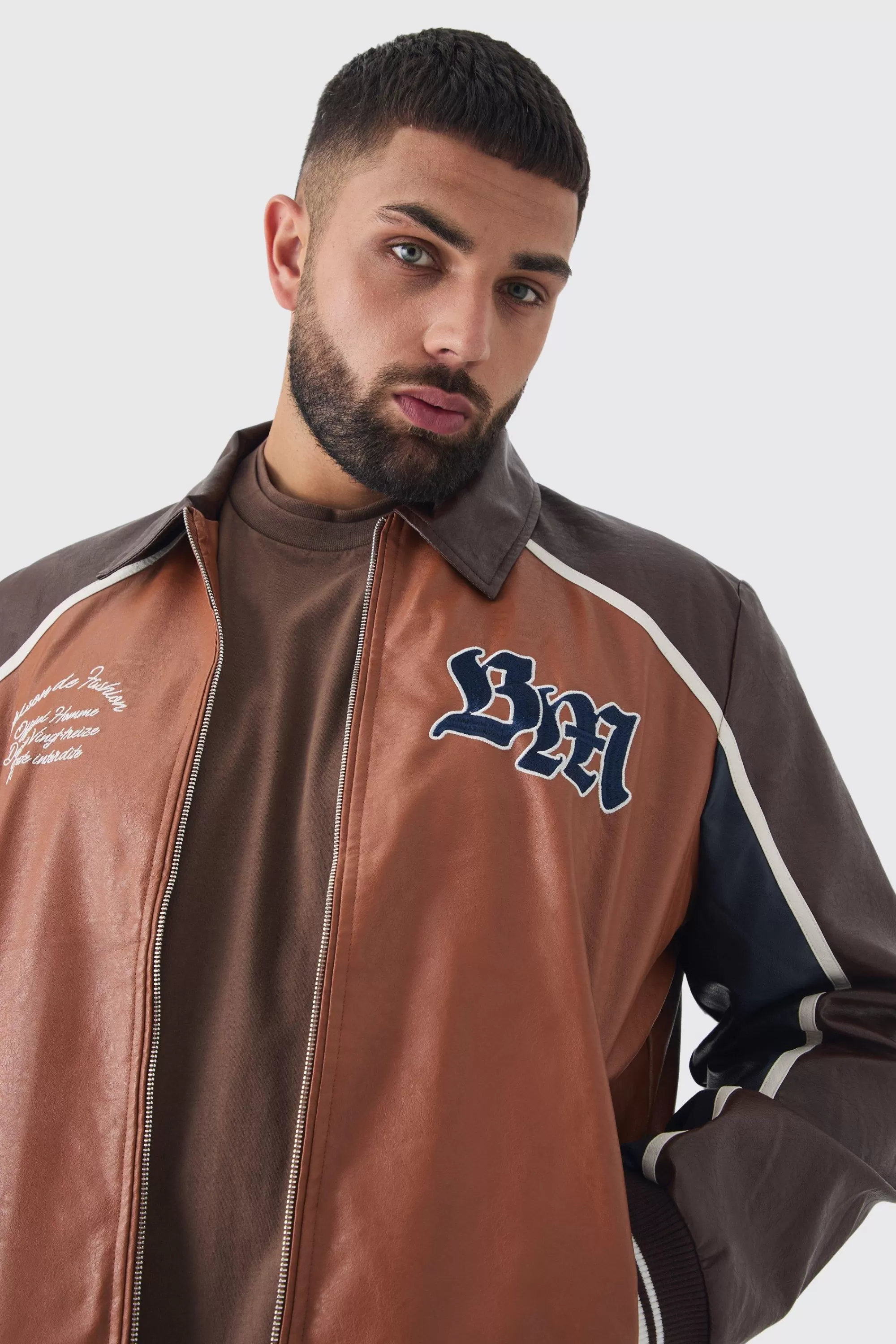 boohooMAN Plus BM Badge Collared PU Varsity Jacket In | UK