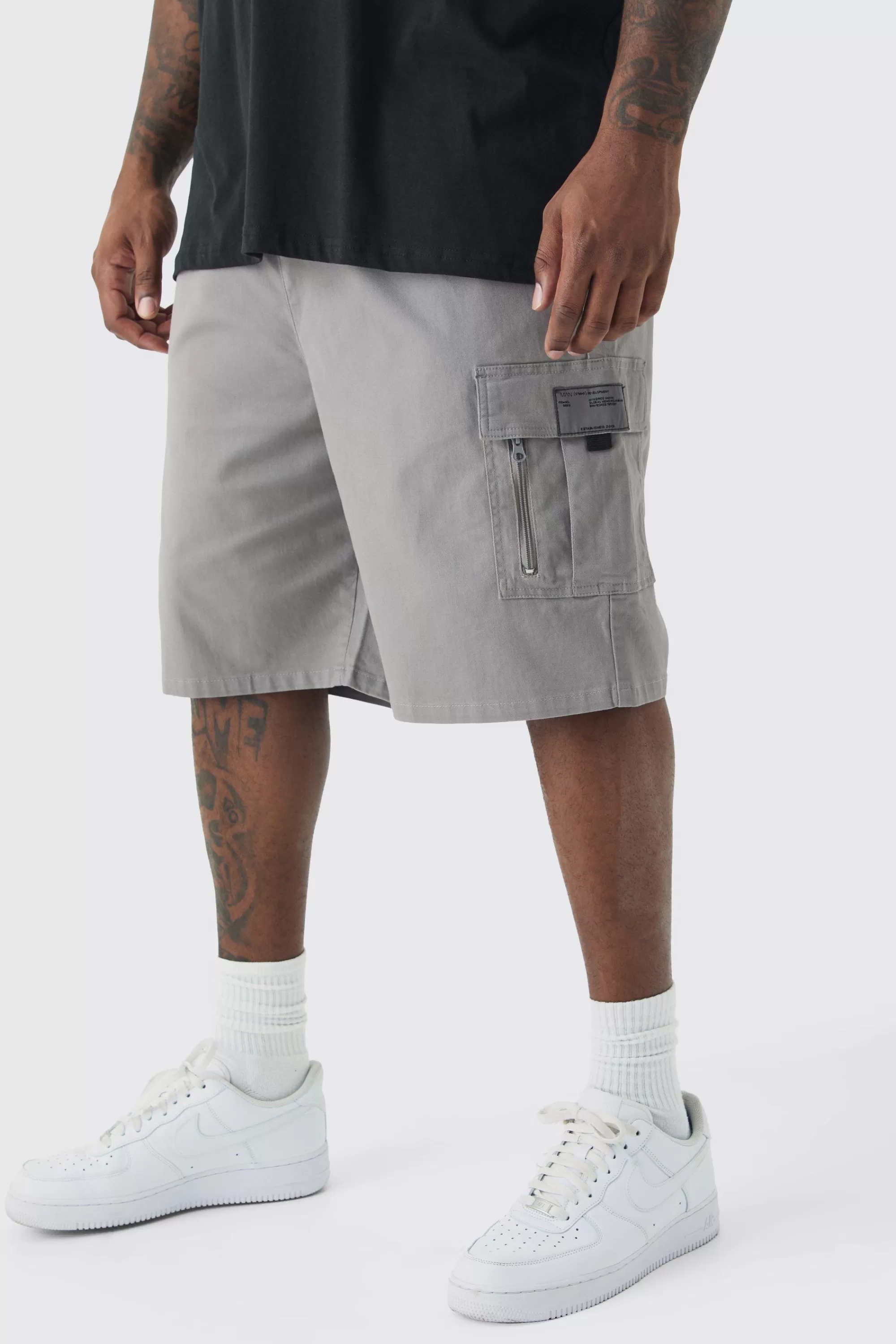 boohooMAN Plus Fixed Waist Twill Relaxed Cargo Zip Detail Tab Short | UK
