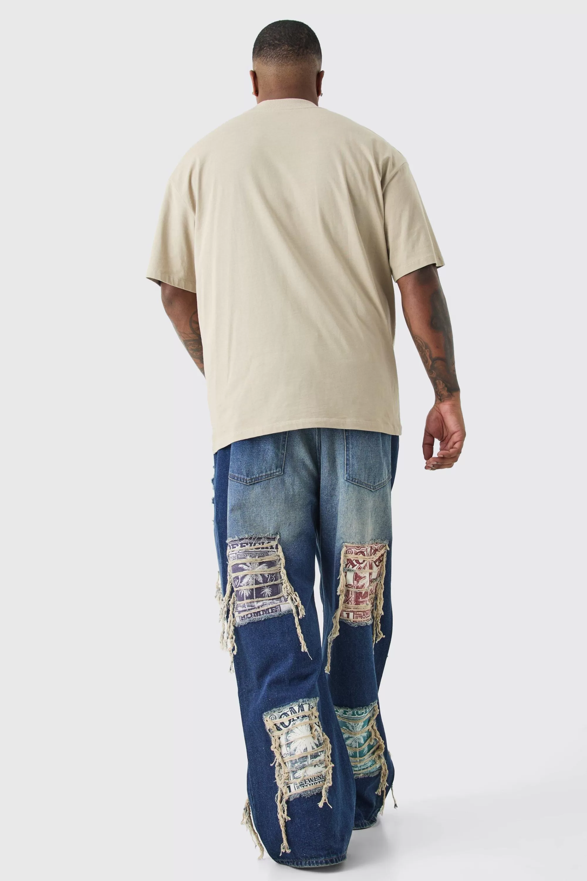 boohooMAN Plus Relaxed Rigid Flare Applique Jeans | UK
