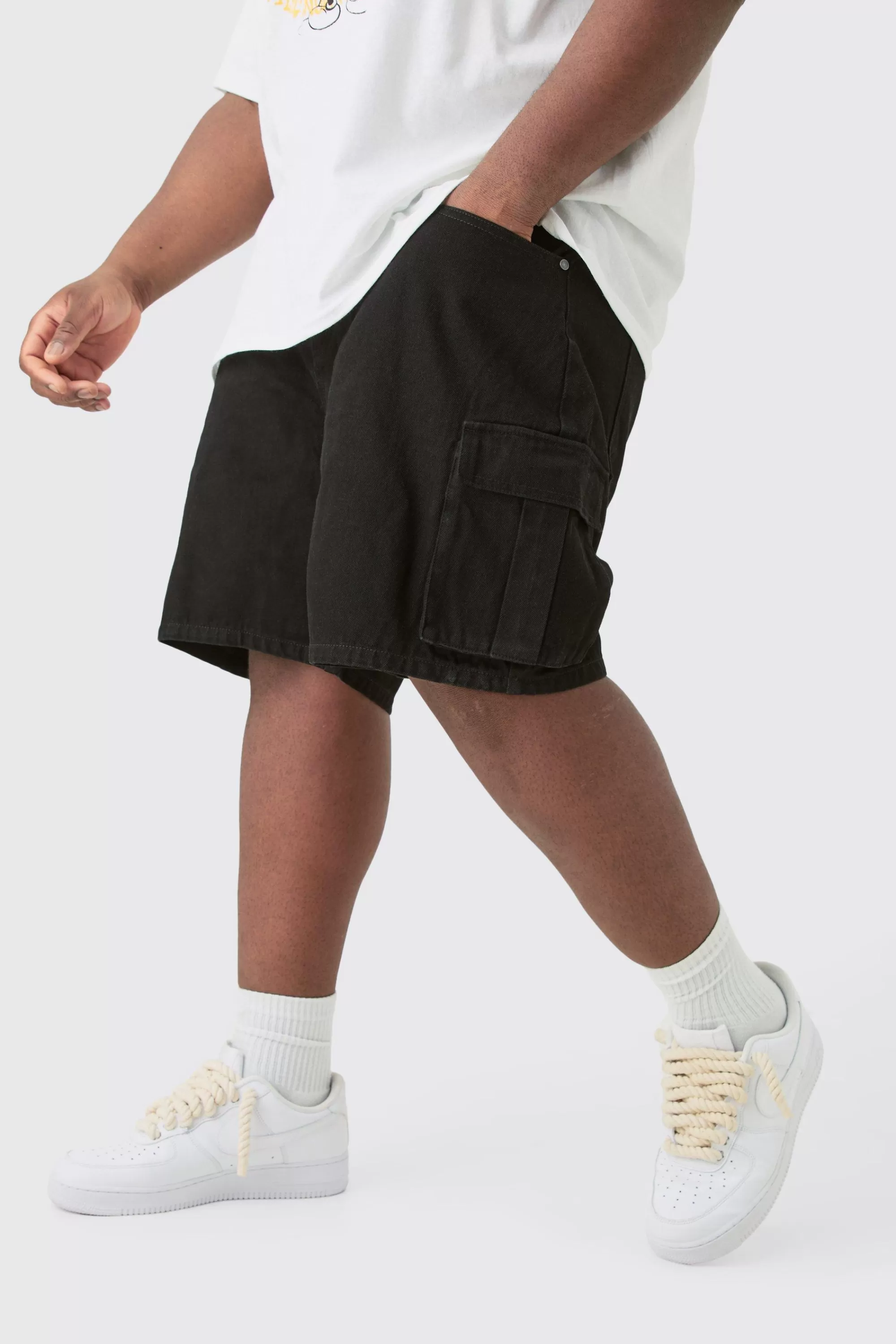 boohooMAN Plus Rigid Denim Relaxed Fit Cargo Shorts In Black | UK