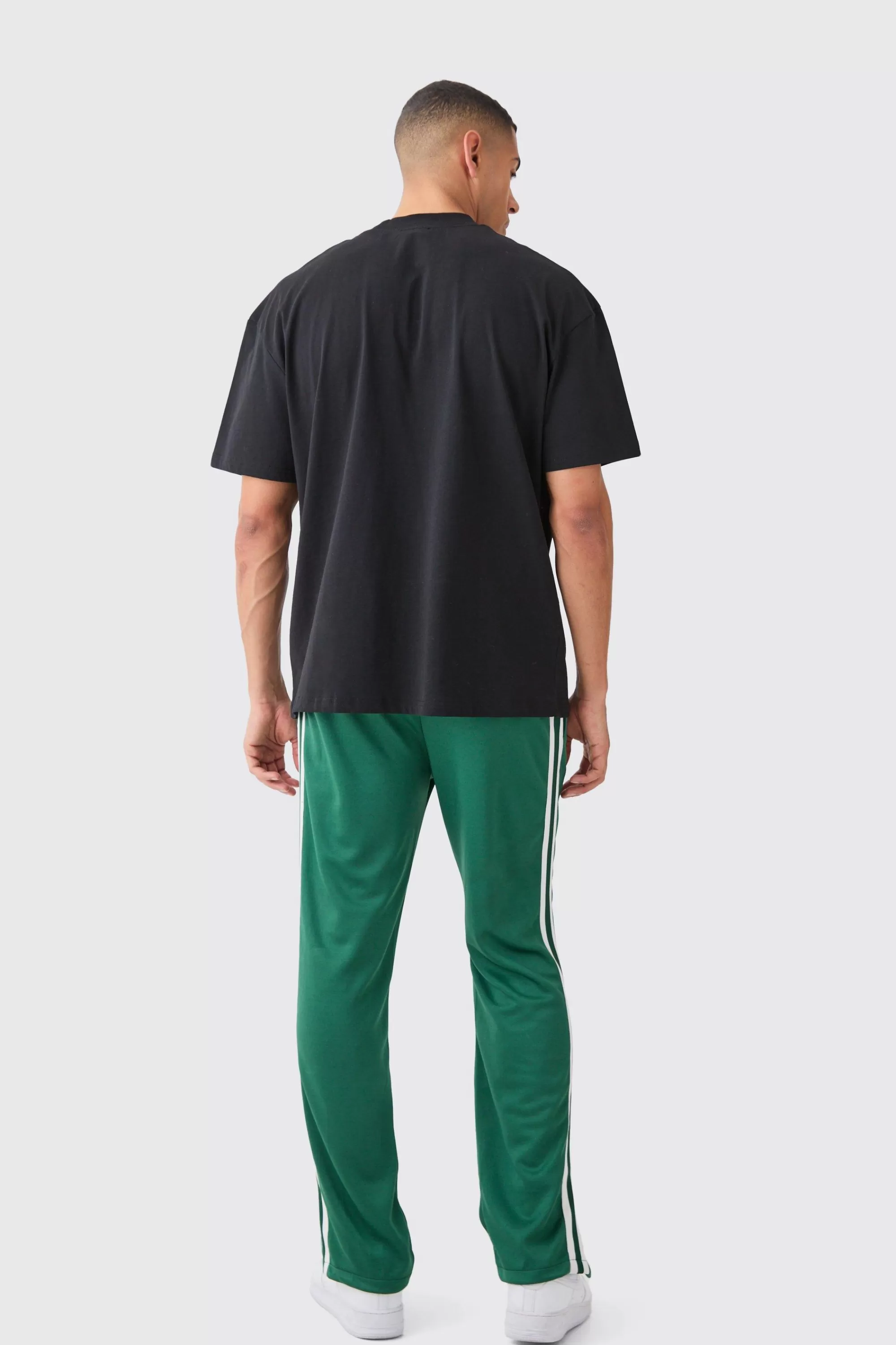 boohooMAN Regular Fit Split Hem Tricot Tape Jogger | UK