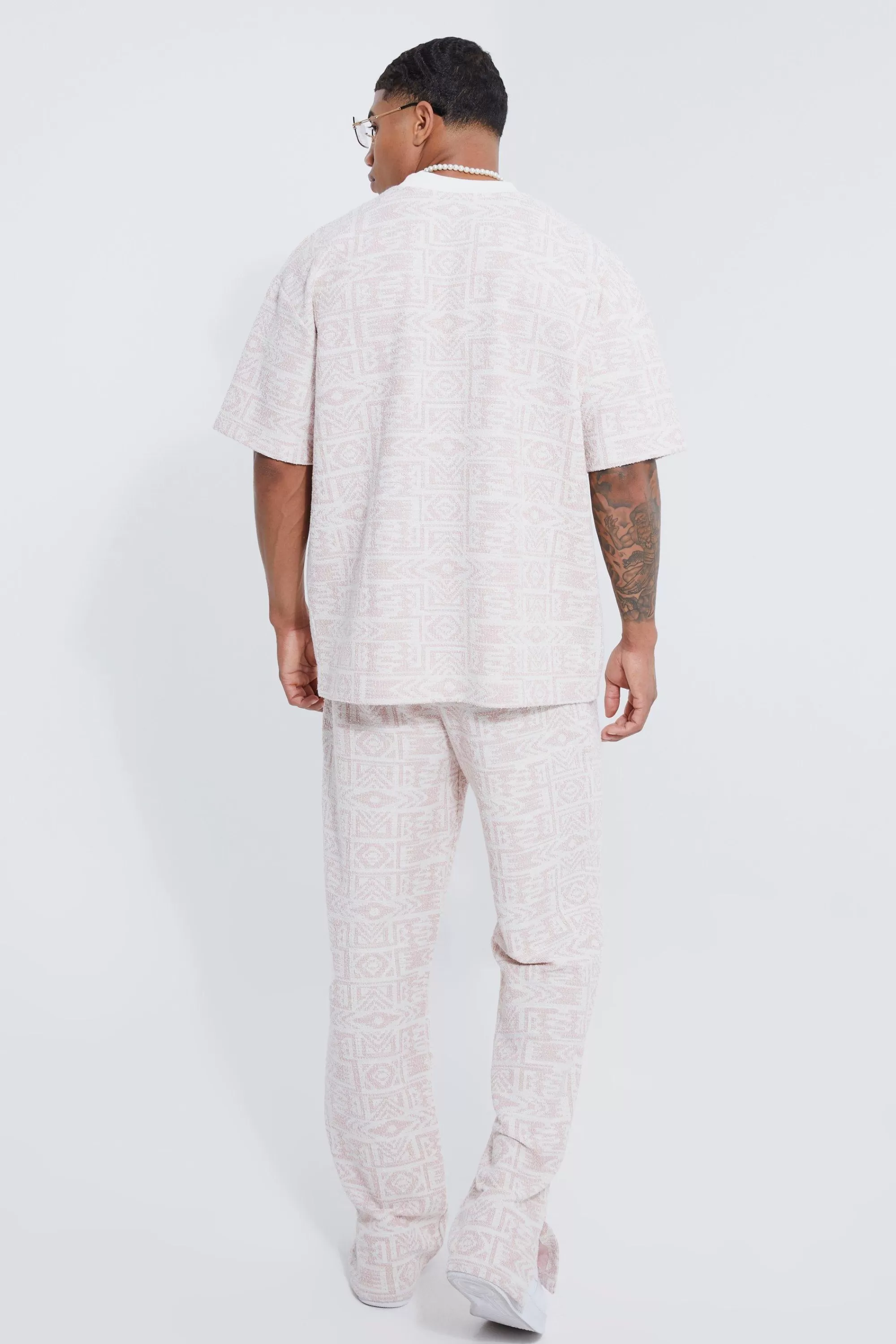boohooMAN Regular Split Hem Jacquard Aztec Jogger | UK