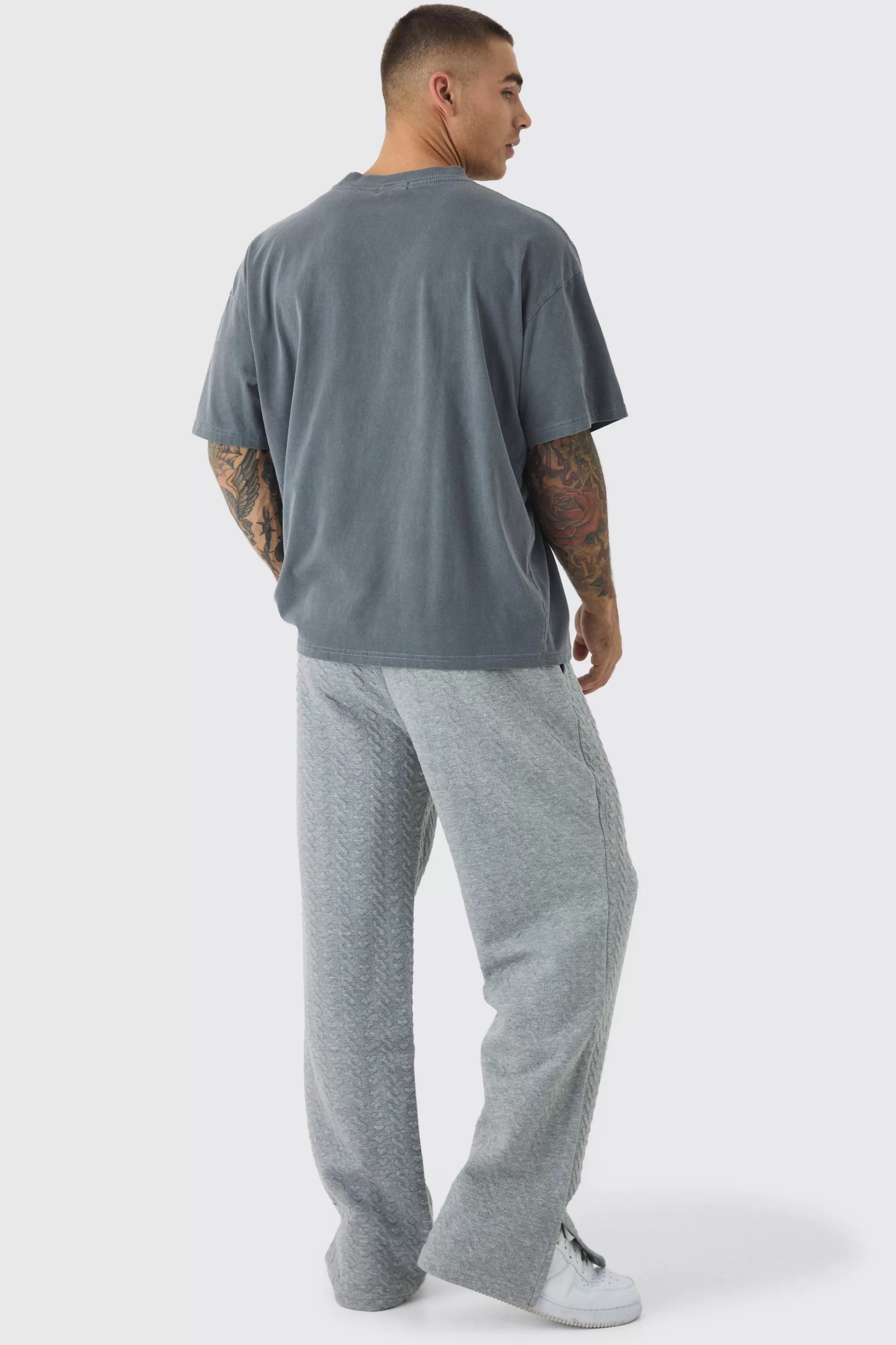 boohooMAN Relaxed Fit Herringbone Split Hem Woven Tab Jogger | UK