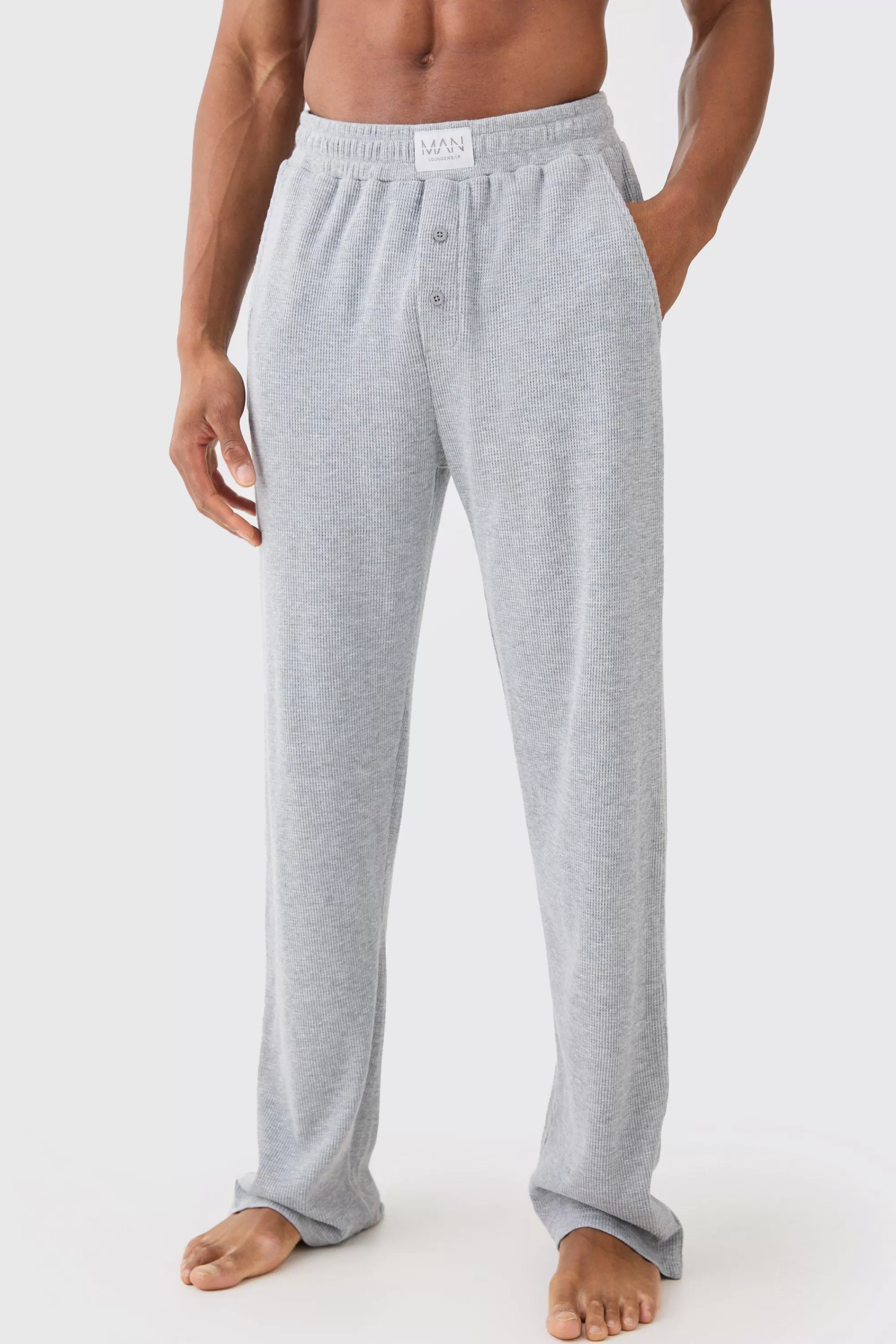 boohooMAN Relaxed Fit Waffle Lounge Bottoms In | UK