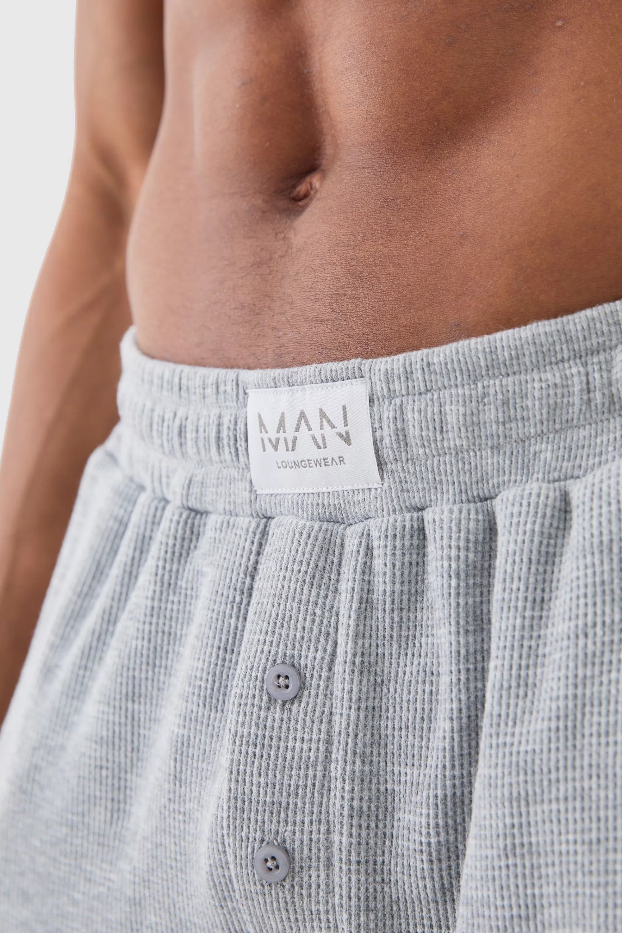boohooMAN Relaxed Fit Waffle Lounge Bottoms In | UK