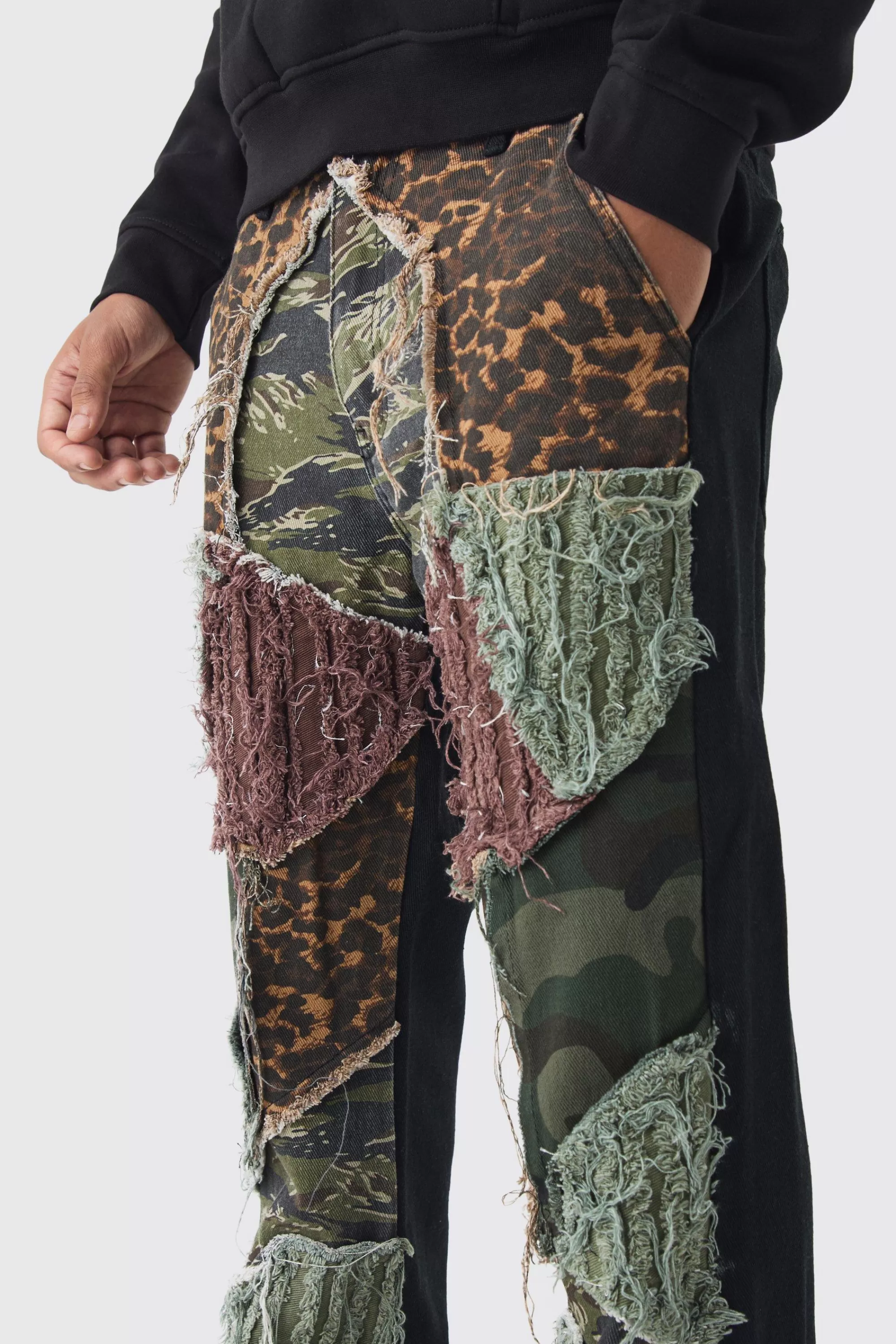 boohooMAN Relaxed Flare Distressed Camo Patchwork Twill Trousers | UK