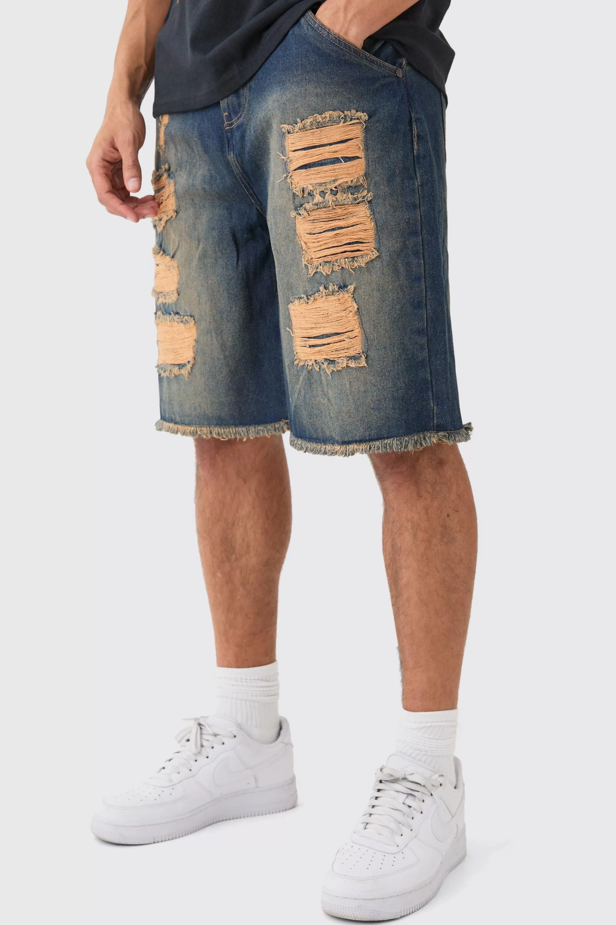 boohooMAN Relaxed Rigid All Over Rips Denim Jorts In | UK