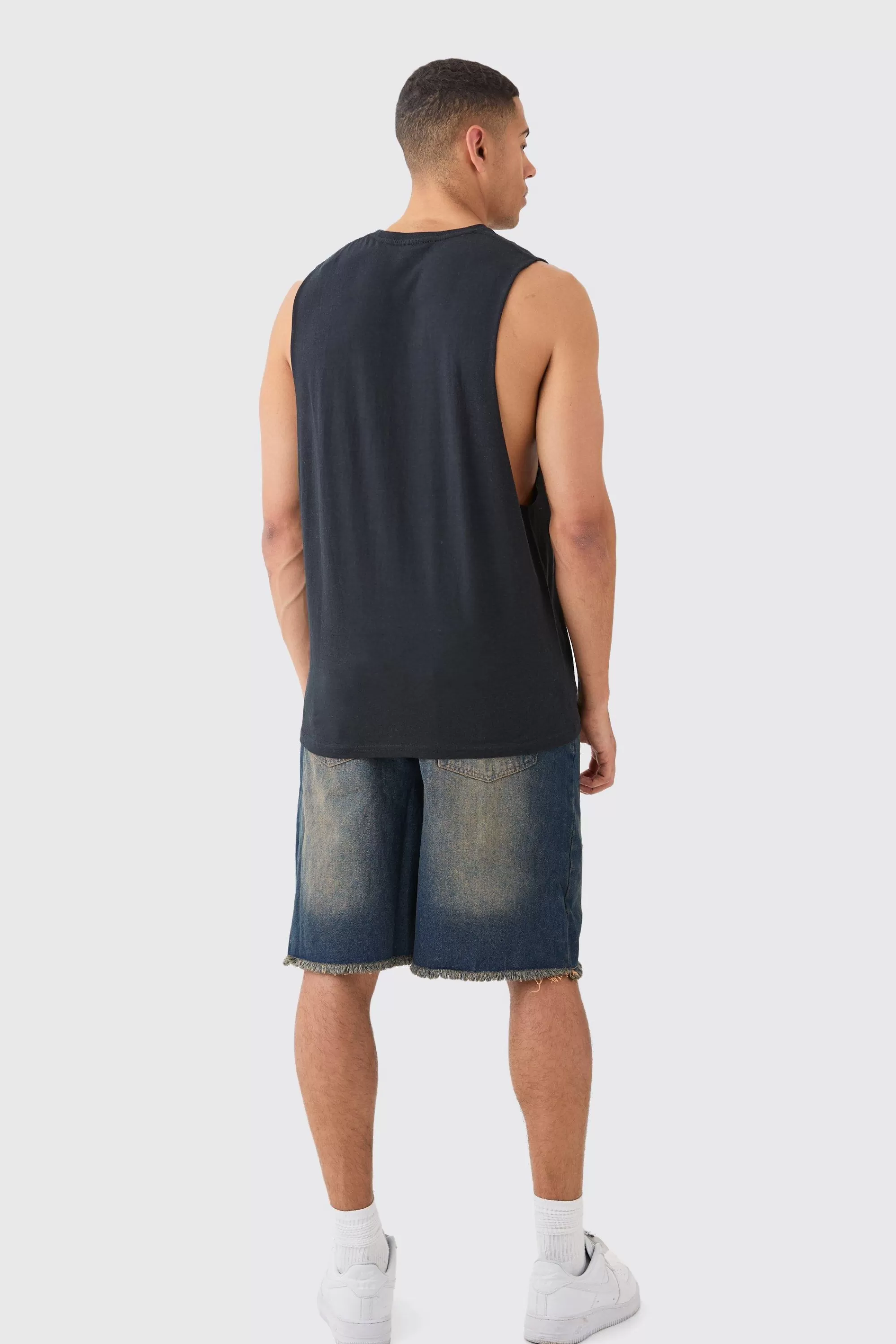 boohooMAN Relaxed Rigid All Over Rips Denim Jorts In | UK