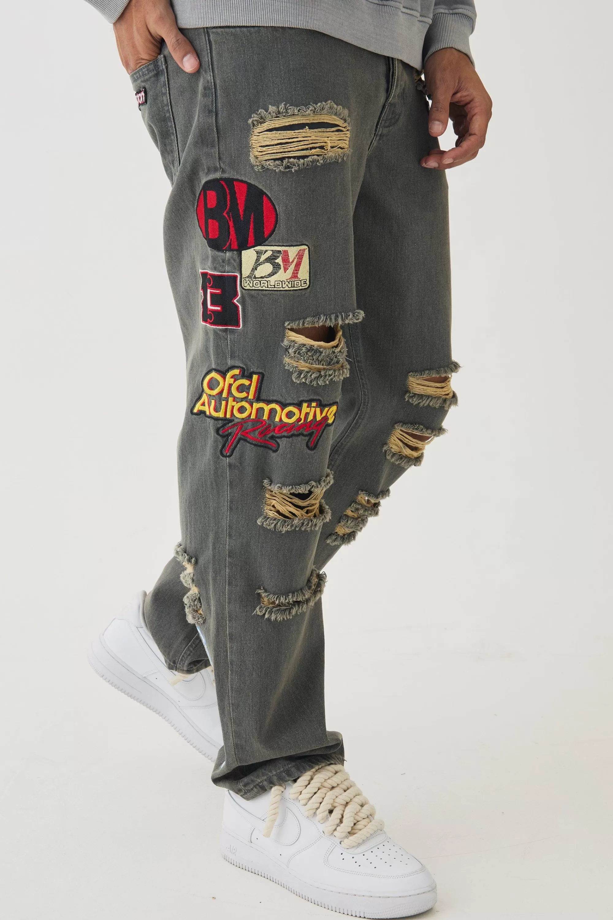 boohooMAN Relaxed Rigid Applique Badge Ripped Jeans | UK