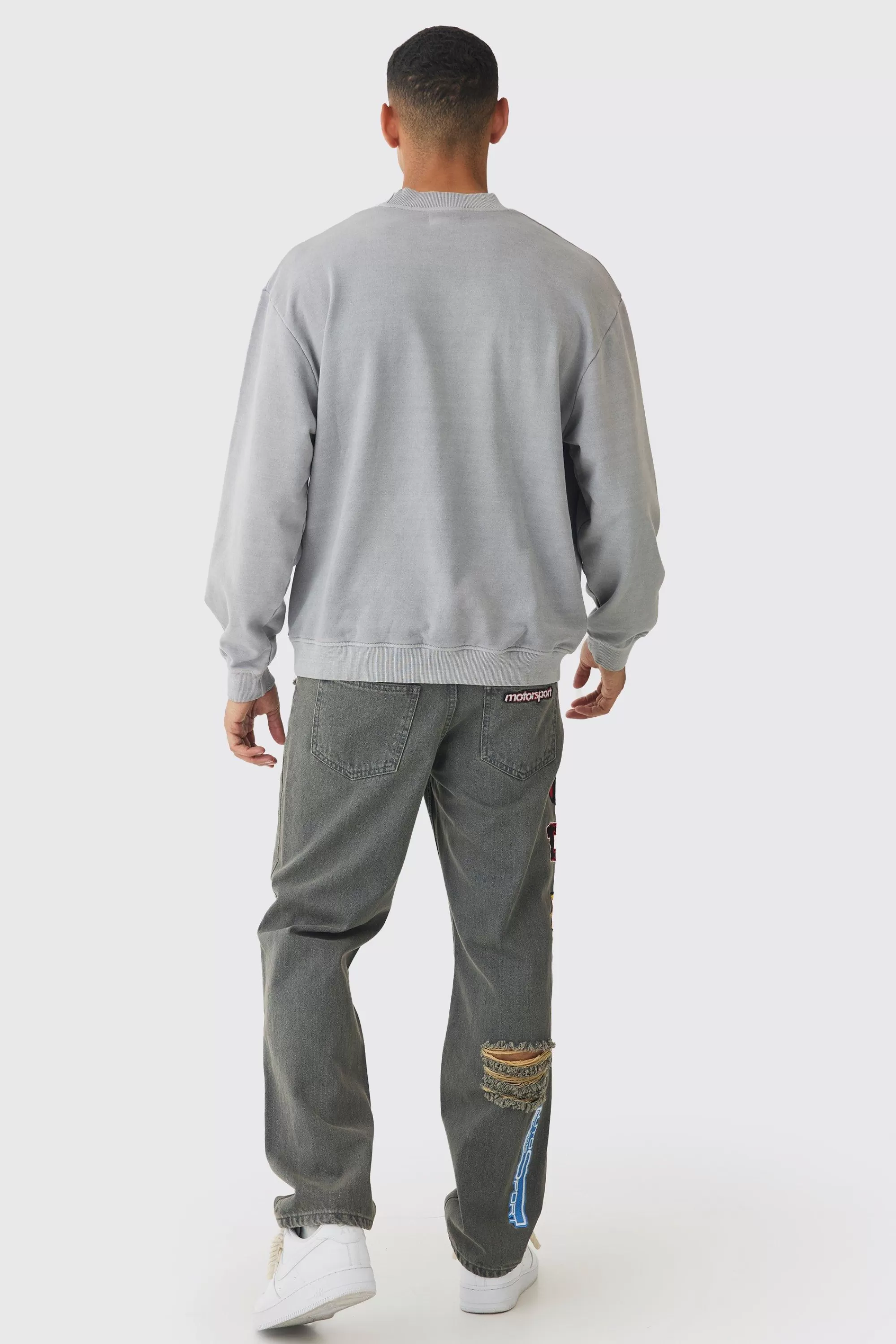 boohooMAN Relaxed Rigid Applique Badge Ripped Jeans | UK