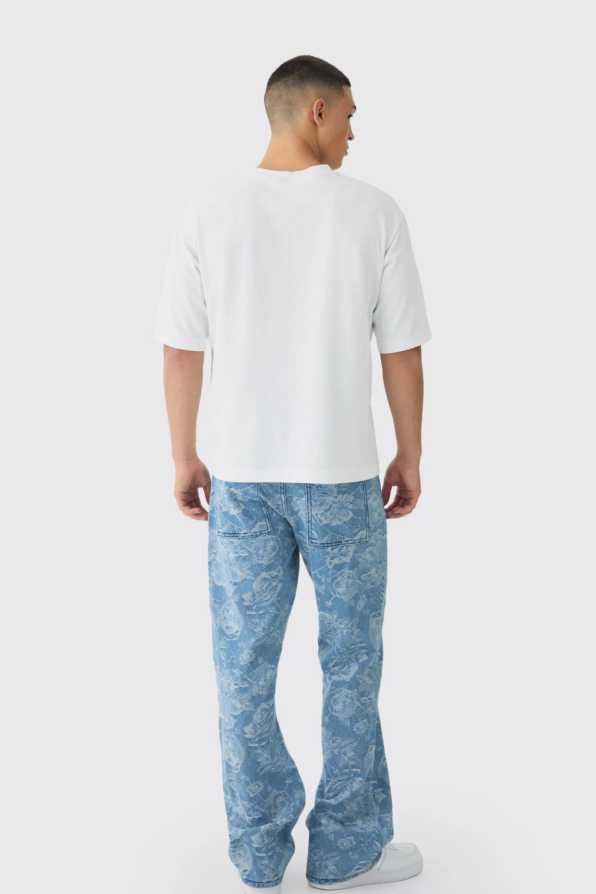 boohooMAN Relaxed Rigid Flare Floral Jacquard Jeans | UK