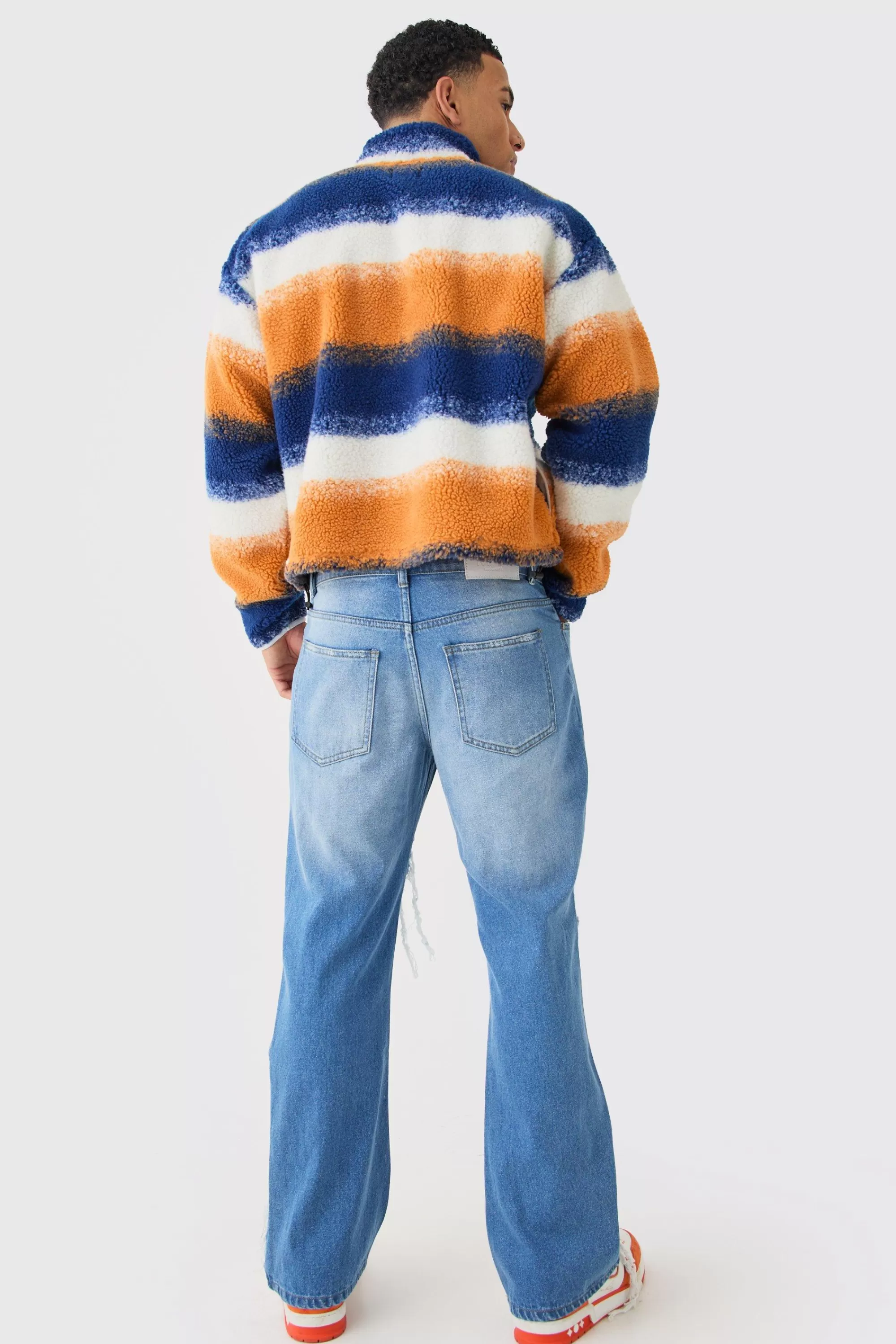 boohooMAN Relaxed Rigid Flare Rip & Repair Applique Jeans | UK