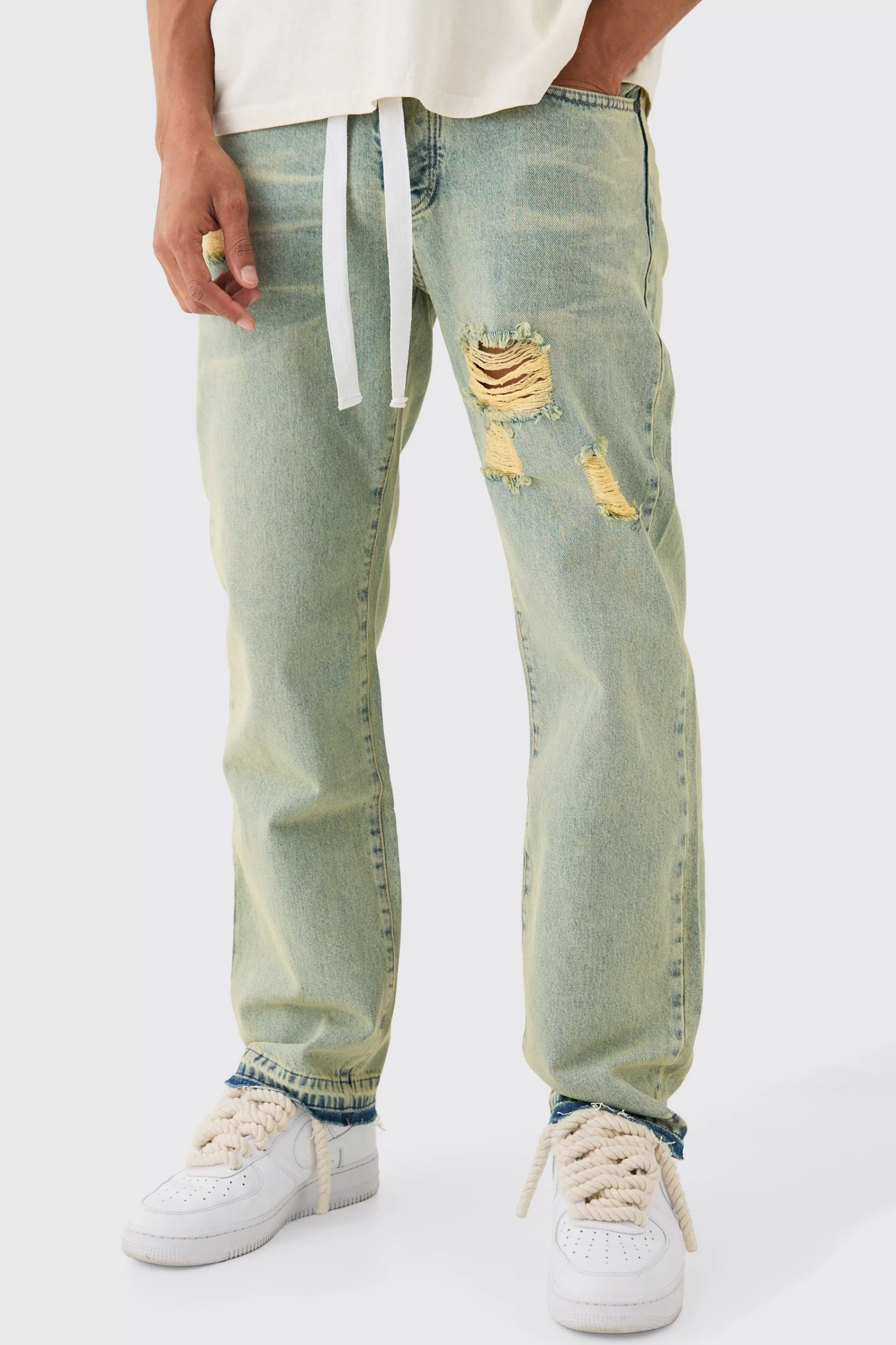 boohooMAN Relaxed Rigid Ripped Let Down Hem Jeans With Extended Drawcords In Wash | UK