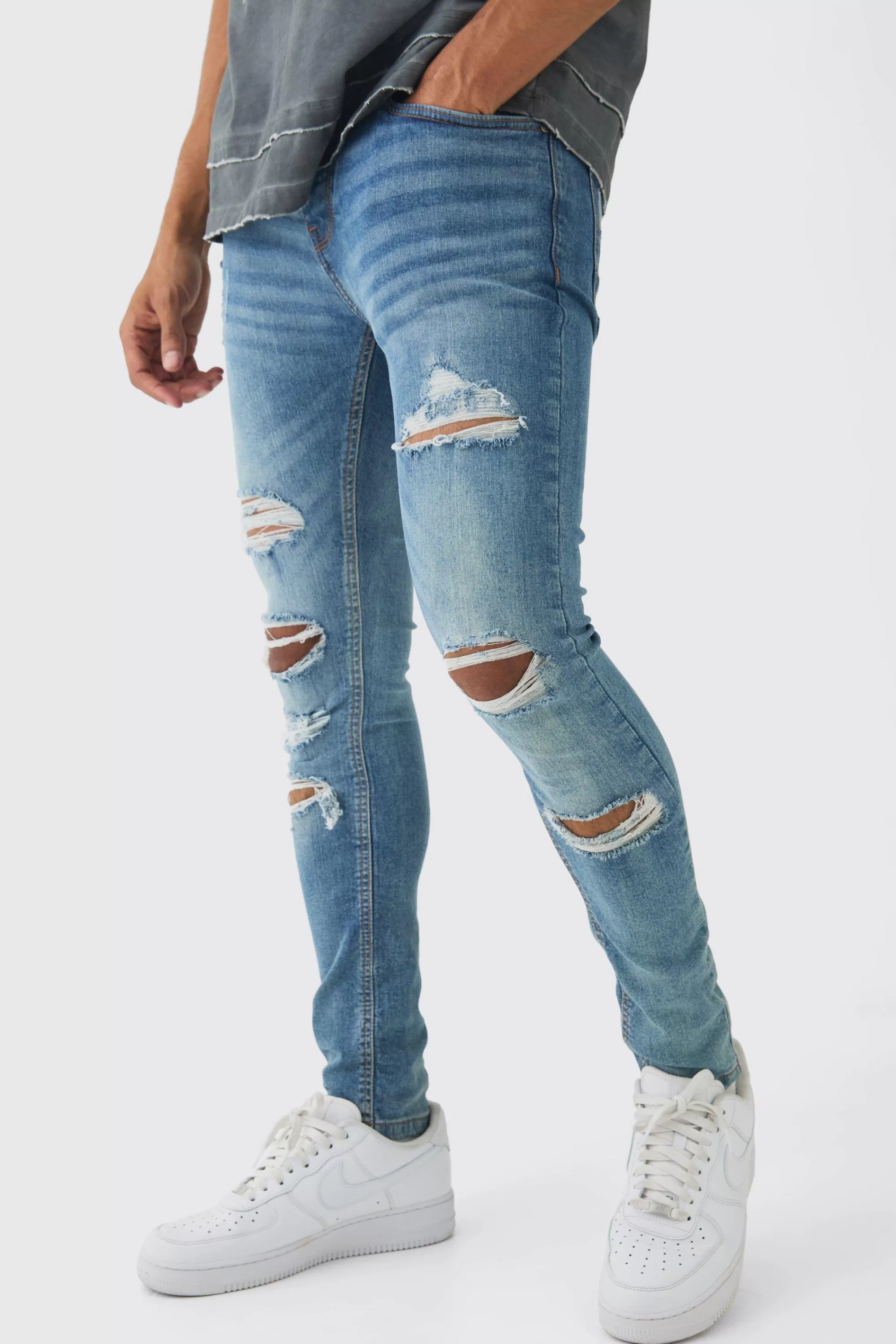 boohooMAN Skinny Fit All Over Ripped Jeans | UK