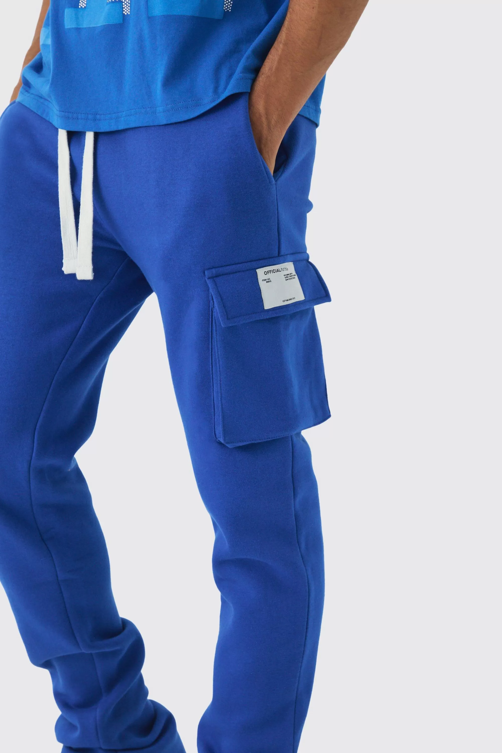 boohooMAN Slim Fit Extreme Stacked Woven Tab Cargo Jogger | UK
