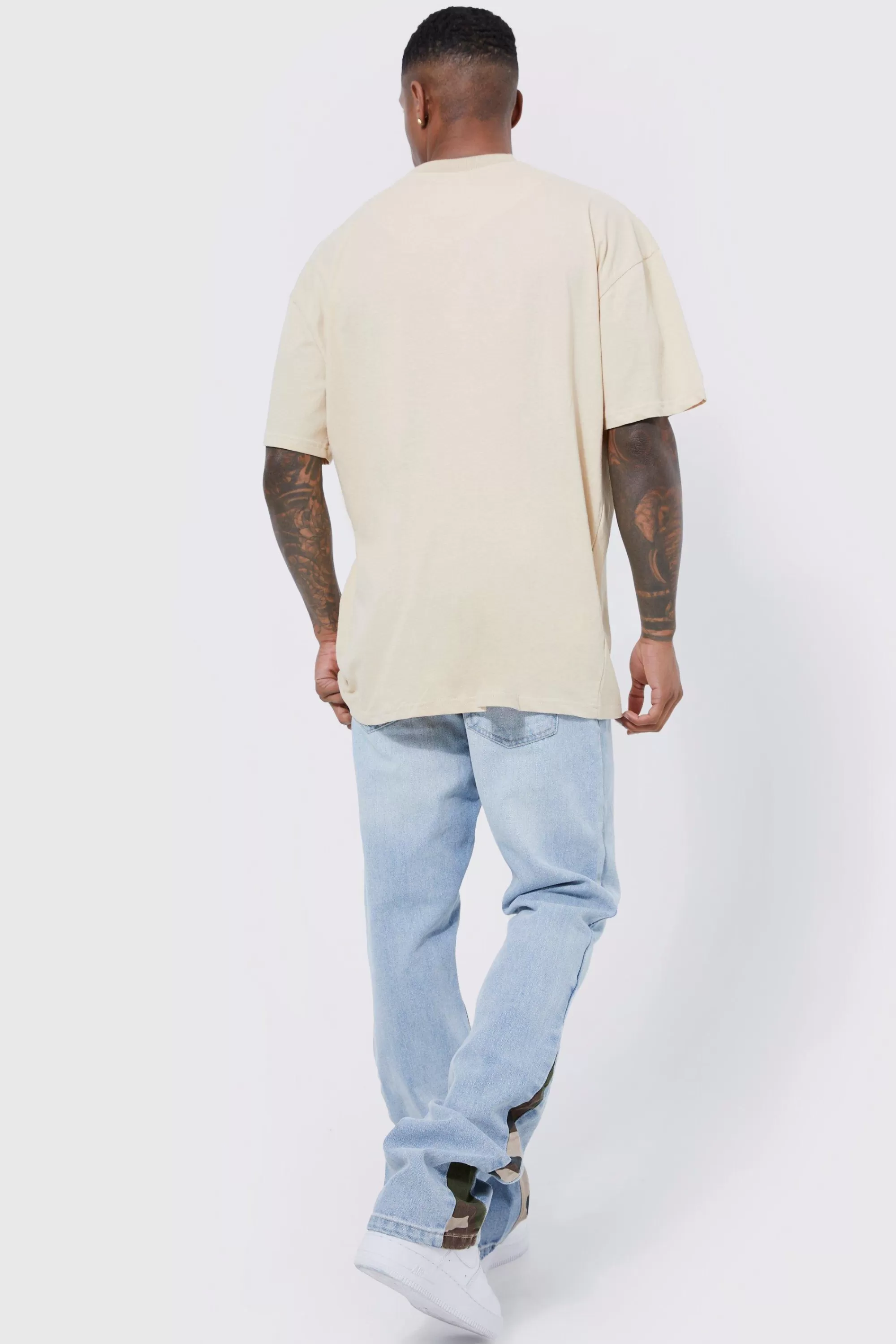 boohooMAN Slim Flare Jeans With Camo Panels | UK