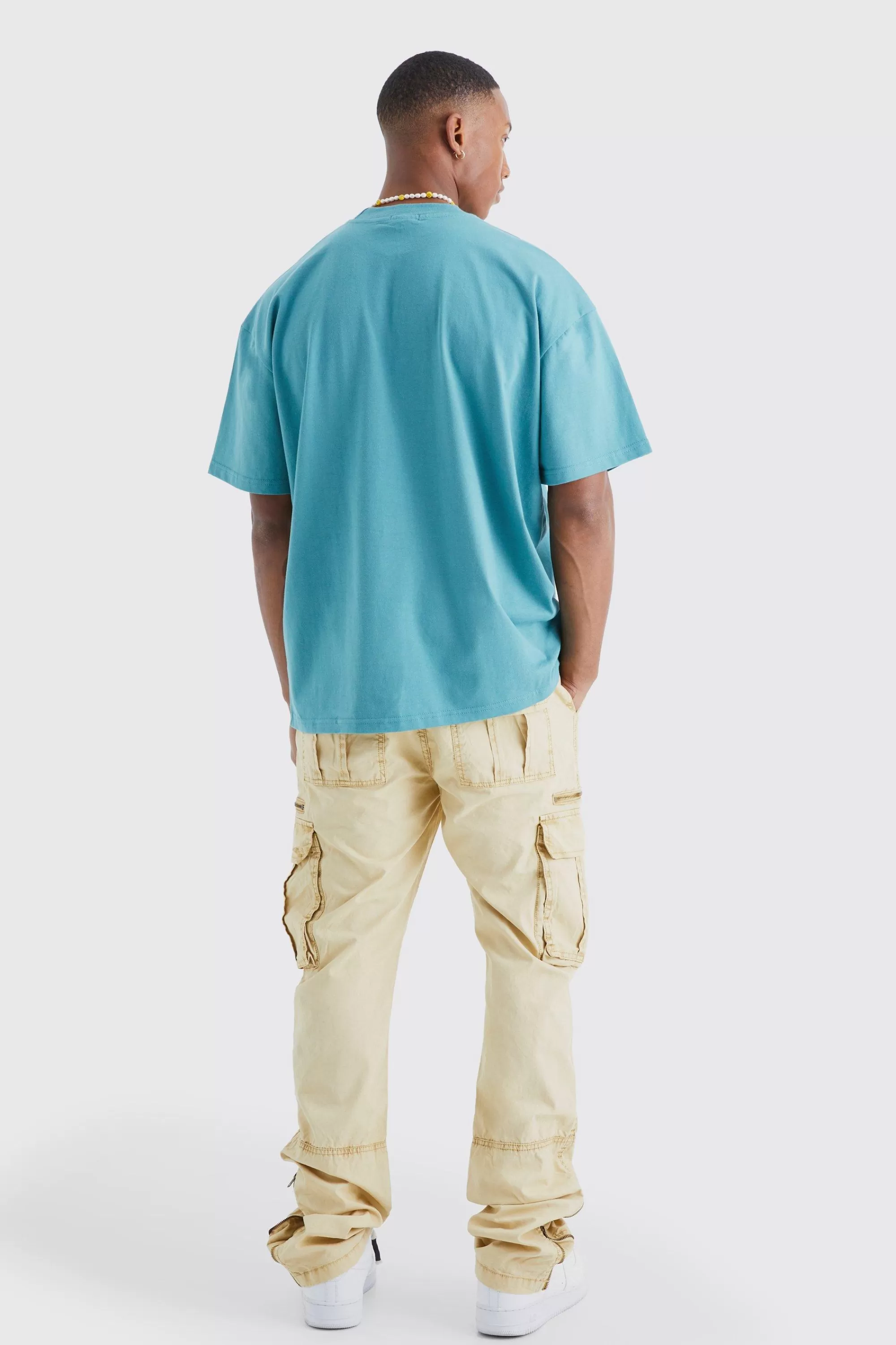 boohooMAN Slim Flare Zip Gusset Overdye Acid Wash Cargo Trouser | UK