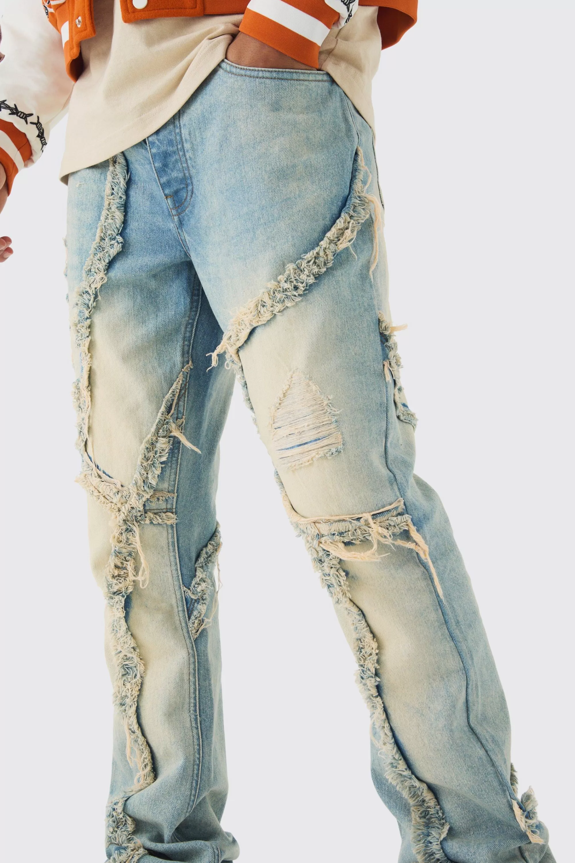 boohooMAN Slim Flared Patchwork Distressed Bleached Jeans | UK