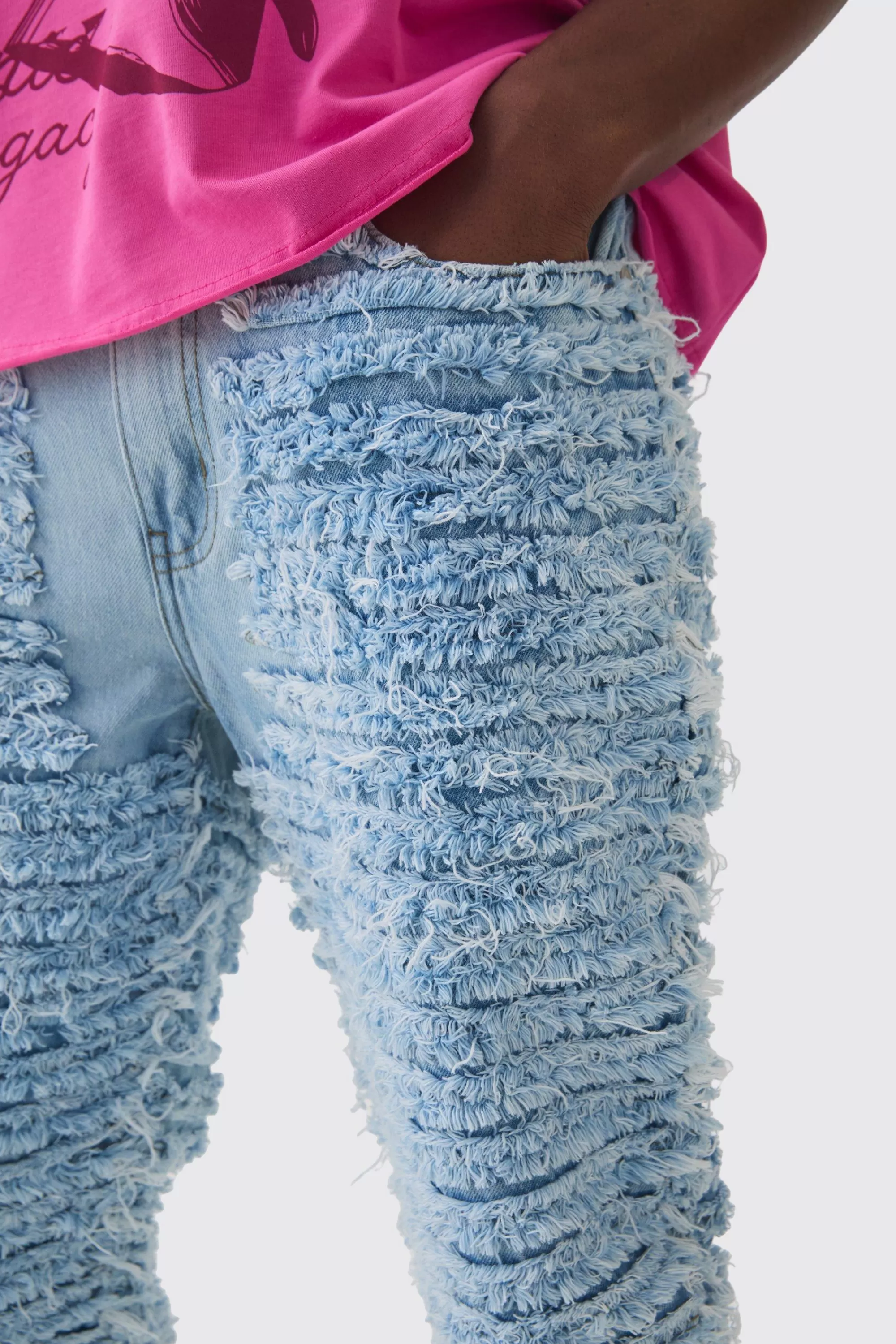 boohooMAN Slim Rigid Flare All Over Distressed Jeans In | UK