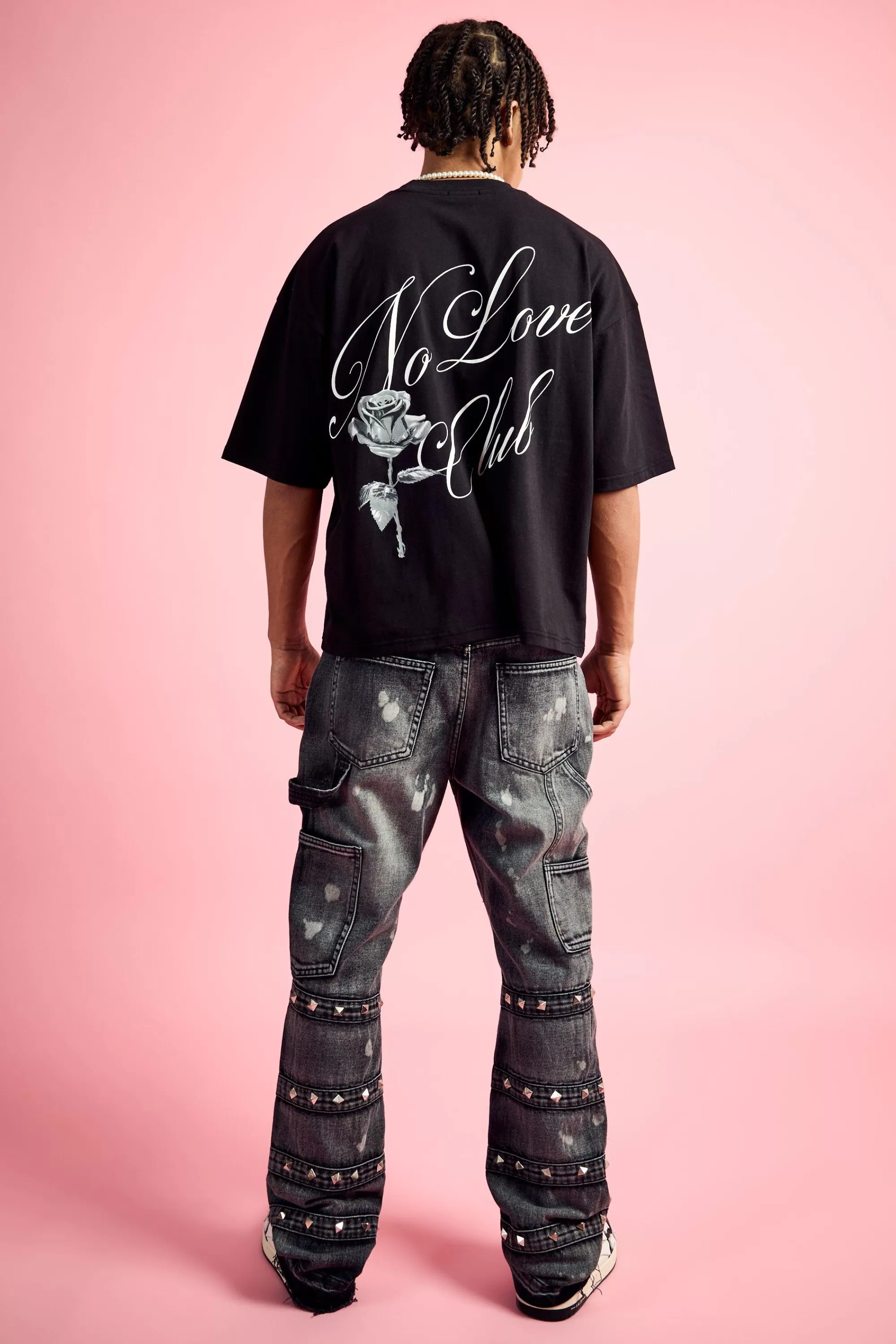 boohooMAN Slim Rigid Flare Embellished Strap Detail Jeans In | UK