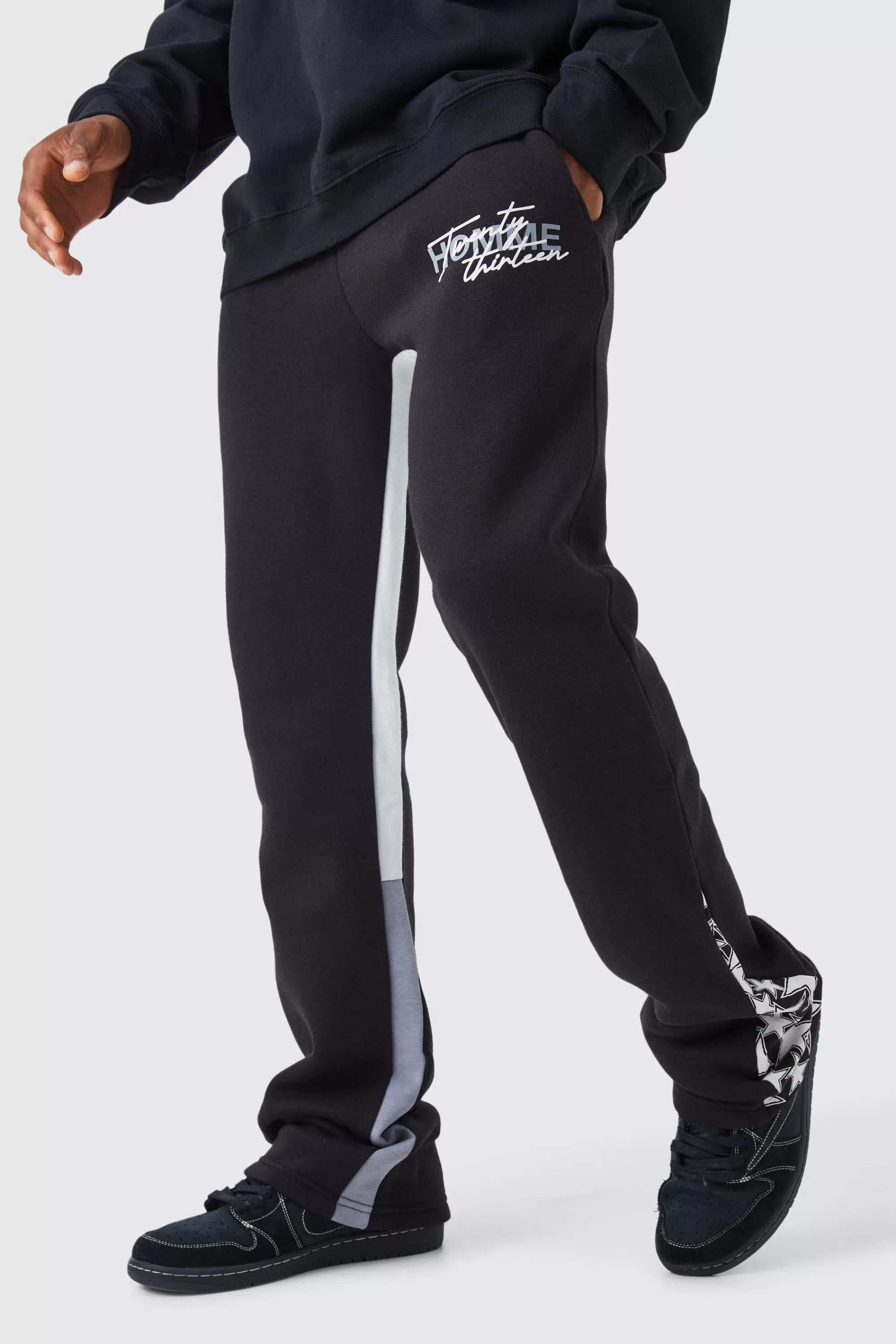 boohooMAN Slim Stacked Flare Star Print Gusset Jogger | UK