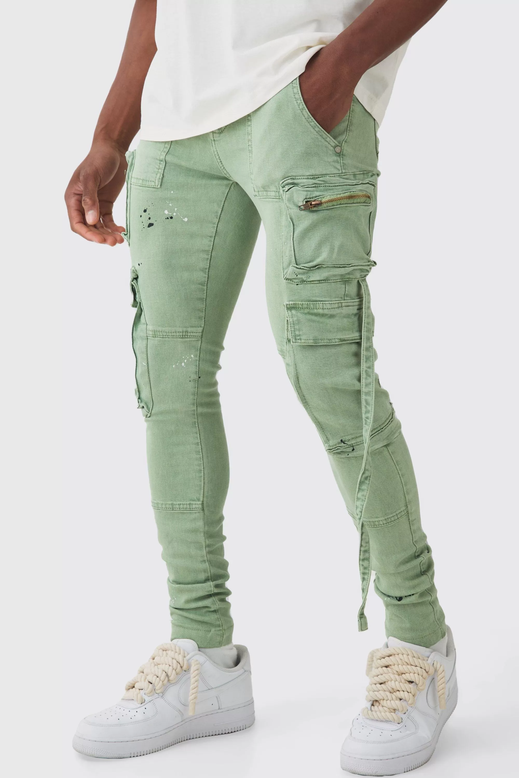 boohooMAN Super Skinny Stretch Strap Detail Paint Splatter Cargo Jeans | UK