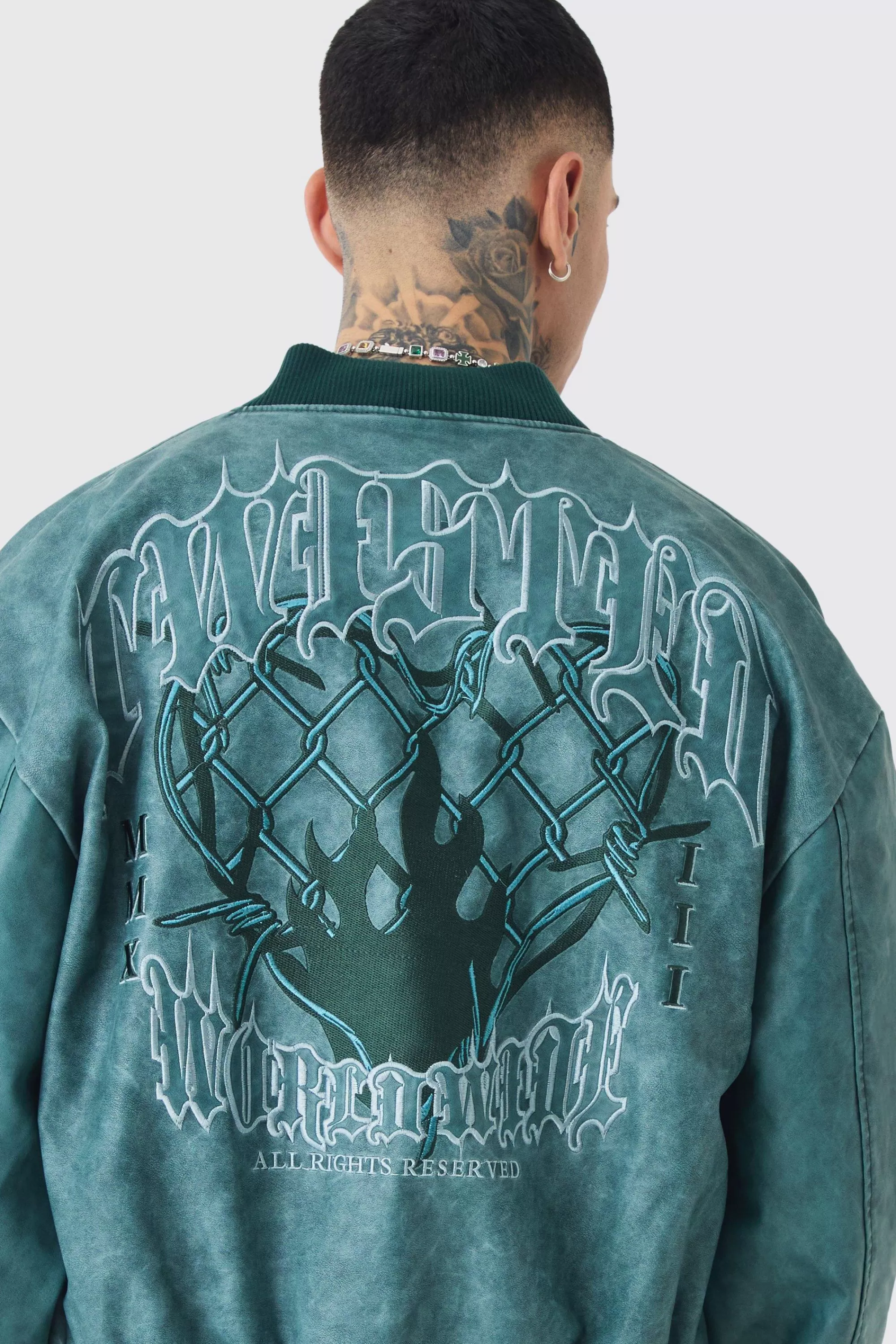 boohooMAN Tall Boxy Tonal Badge Tumbled PU Varsity Jacket In | UK