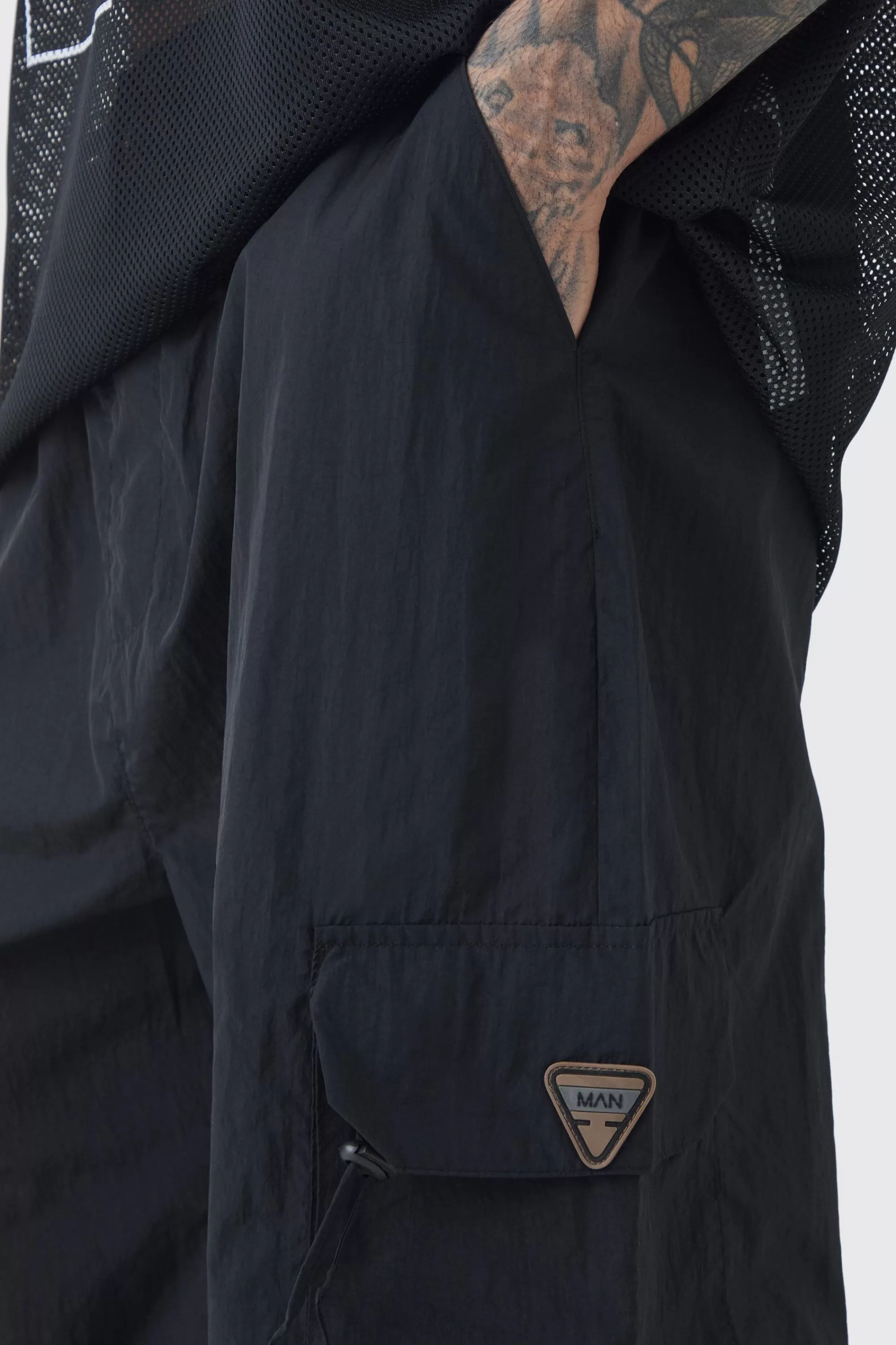boohooMAN Tall Crinkle Nylon Cargo Parachute Trousers In | UK