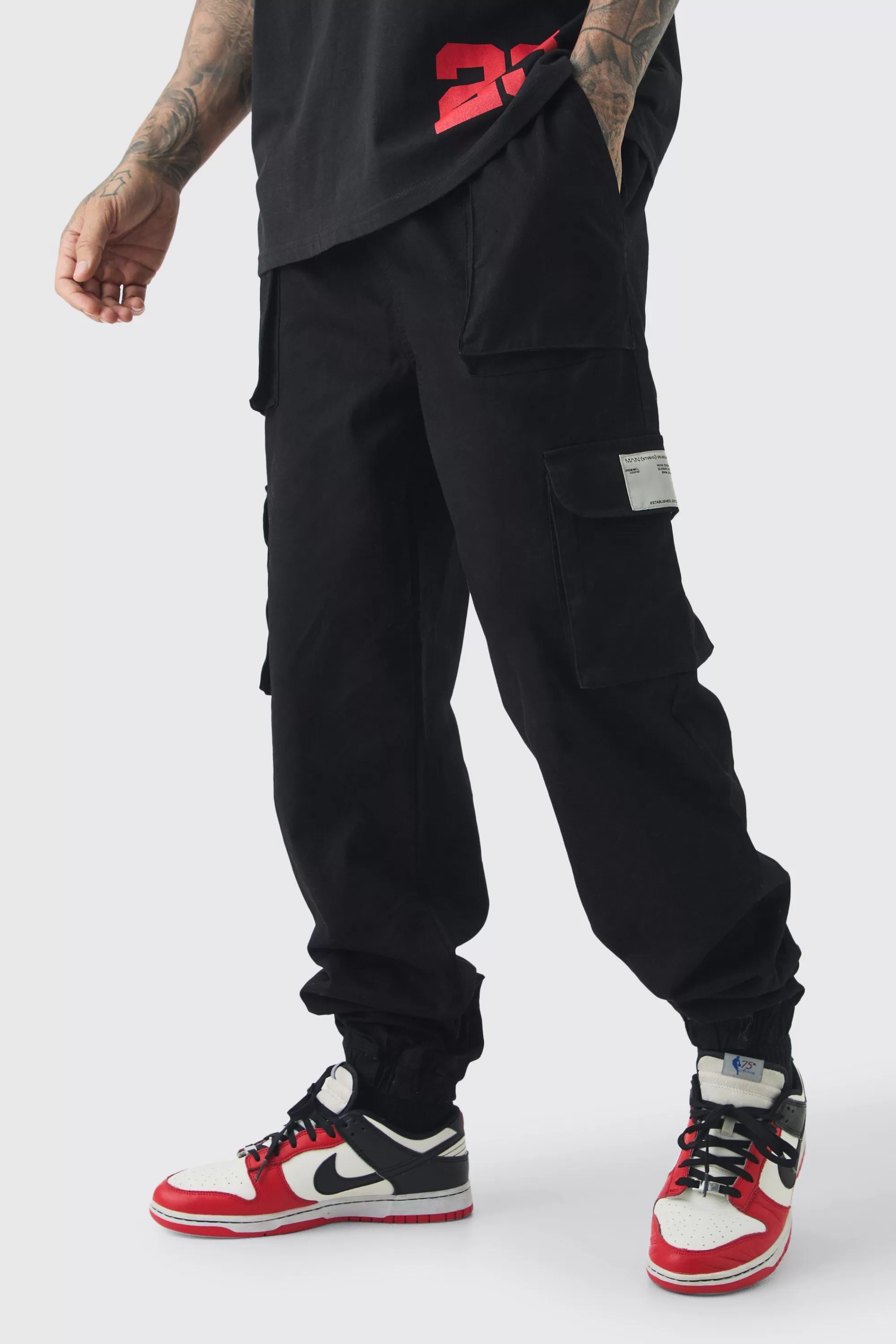 boohooMAN Tall Cuffed Hem Woven Tab Cargo Trousers In | UK