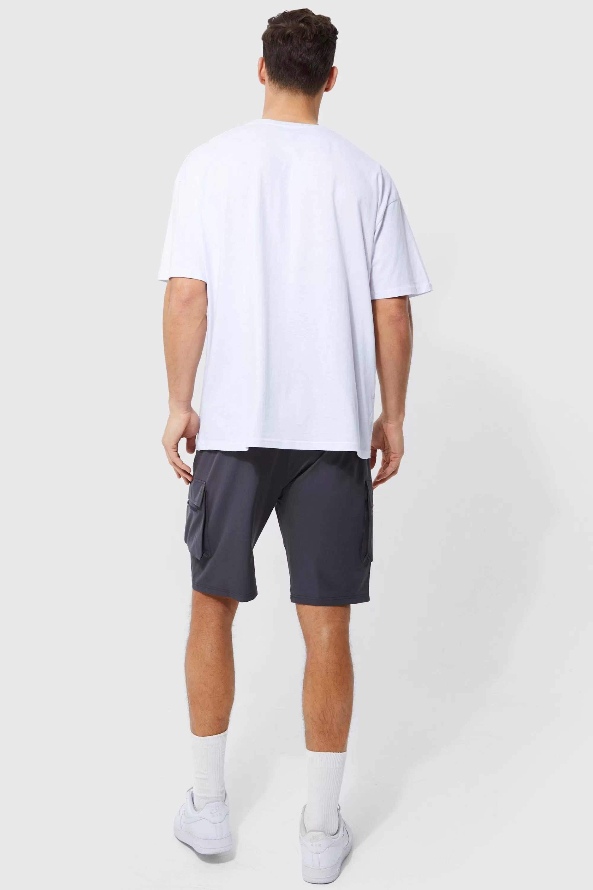 boohooMAN Tall Elastic Waist 4 Way Stretch Cargo Short | UK