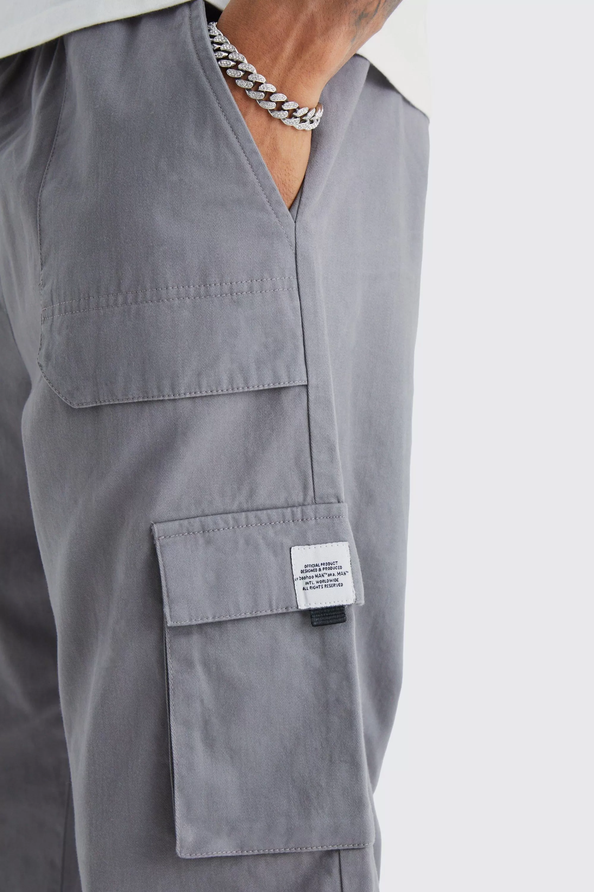 boohooMAN Tall Elastic Waist Relaxed Fit Buckle Cargo Jogger | UK