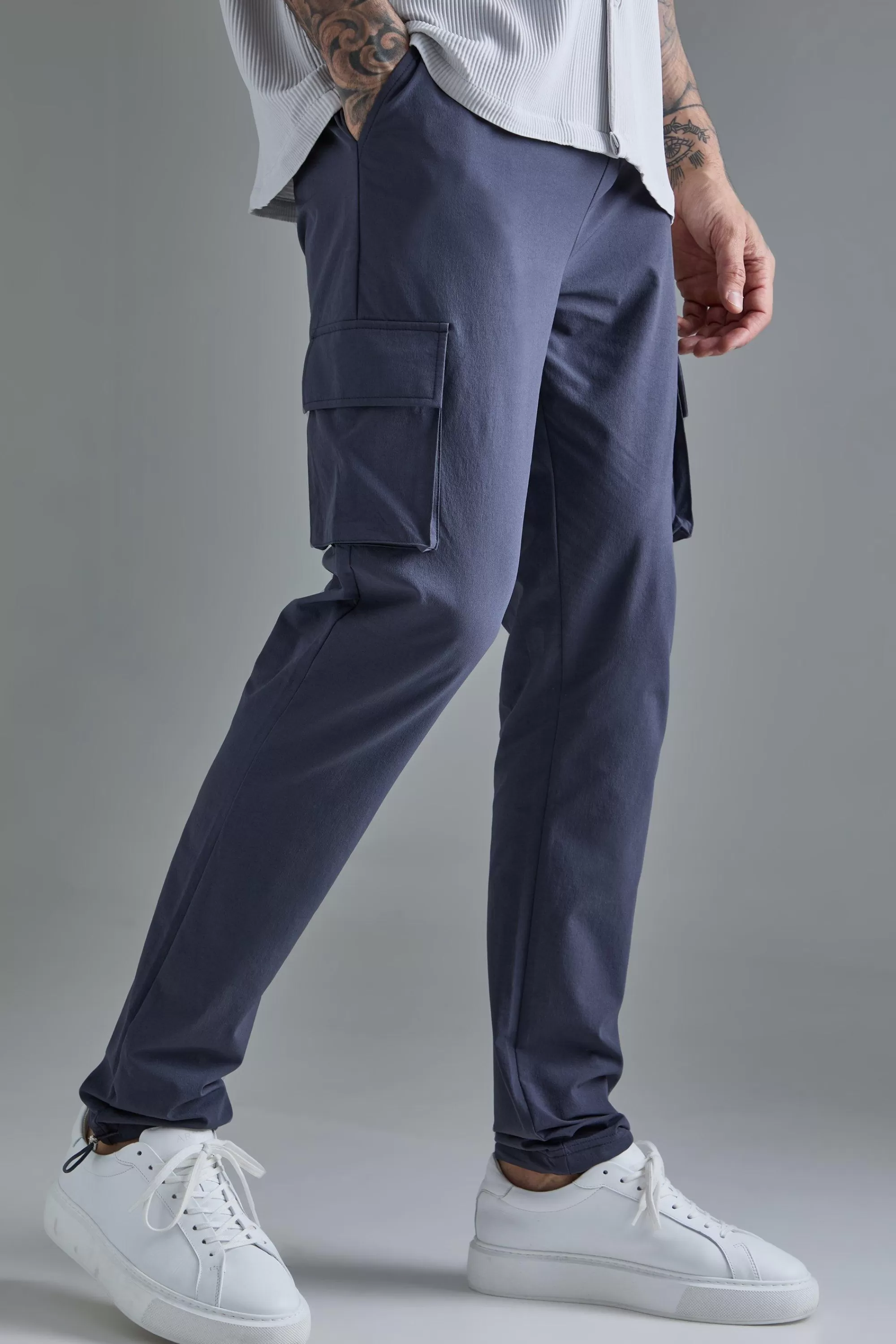 boohooMAN Tall Elasticated Lightweight Technical Stretch Skinny Cargo Trouser | UK