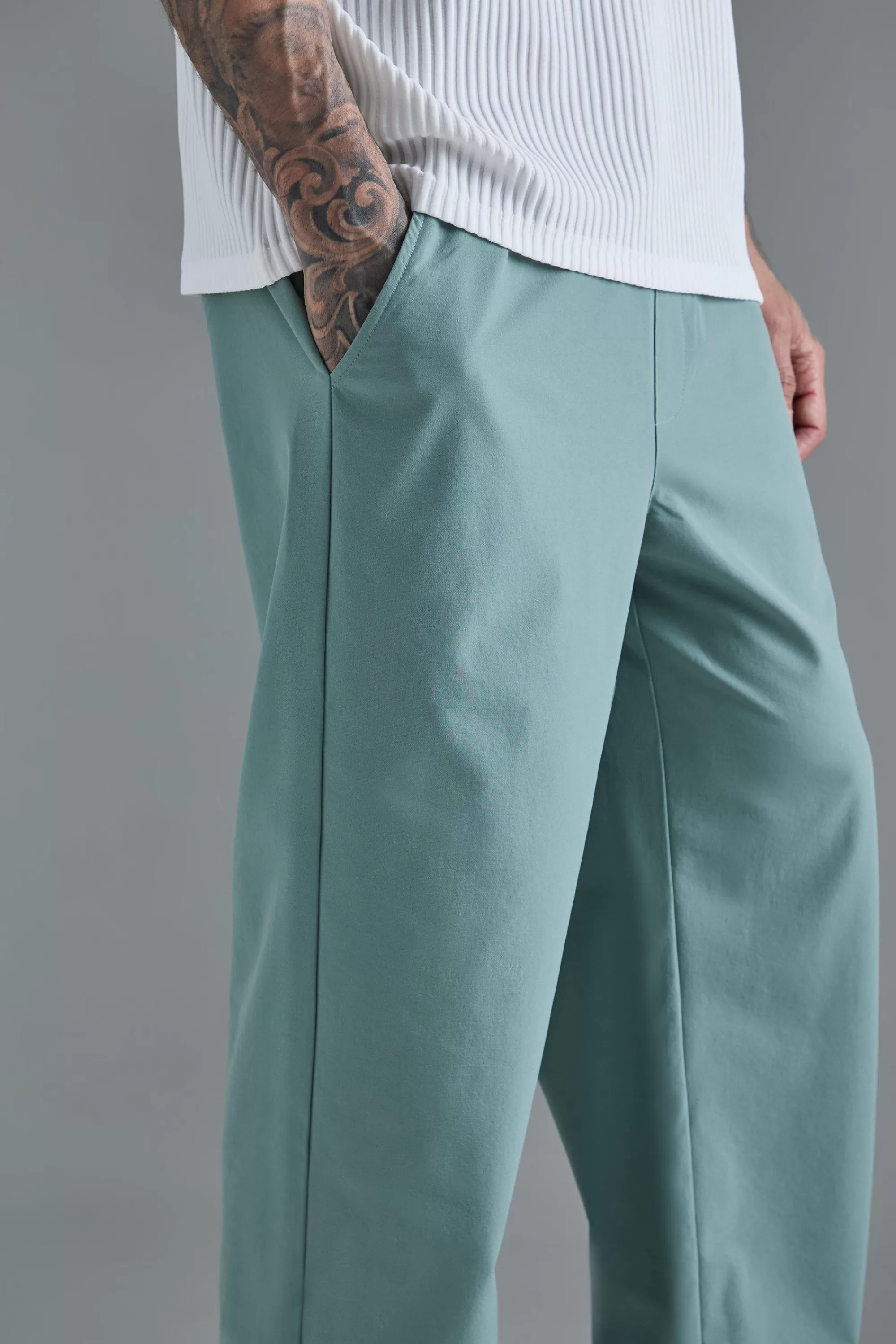 boohooMAN Tall Elasticated Waist Lightweight Technical Stretch Relaxed Trouser | UK