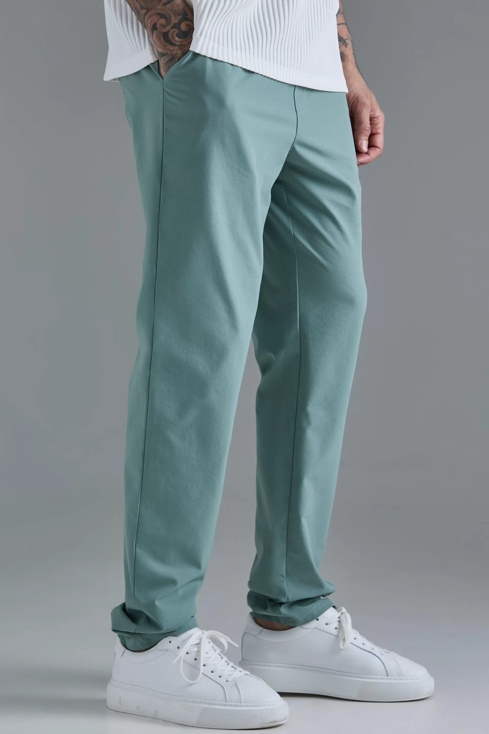 boohooMAN Tall Elasticated Waist Lightweight Technical Stretch Slim Trouser | UK