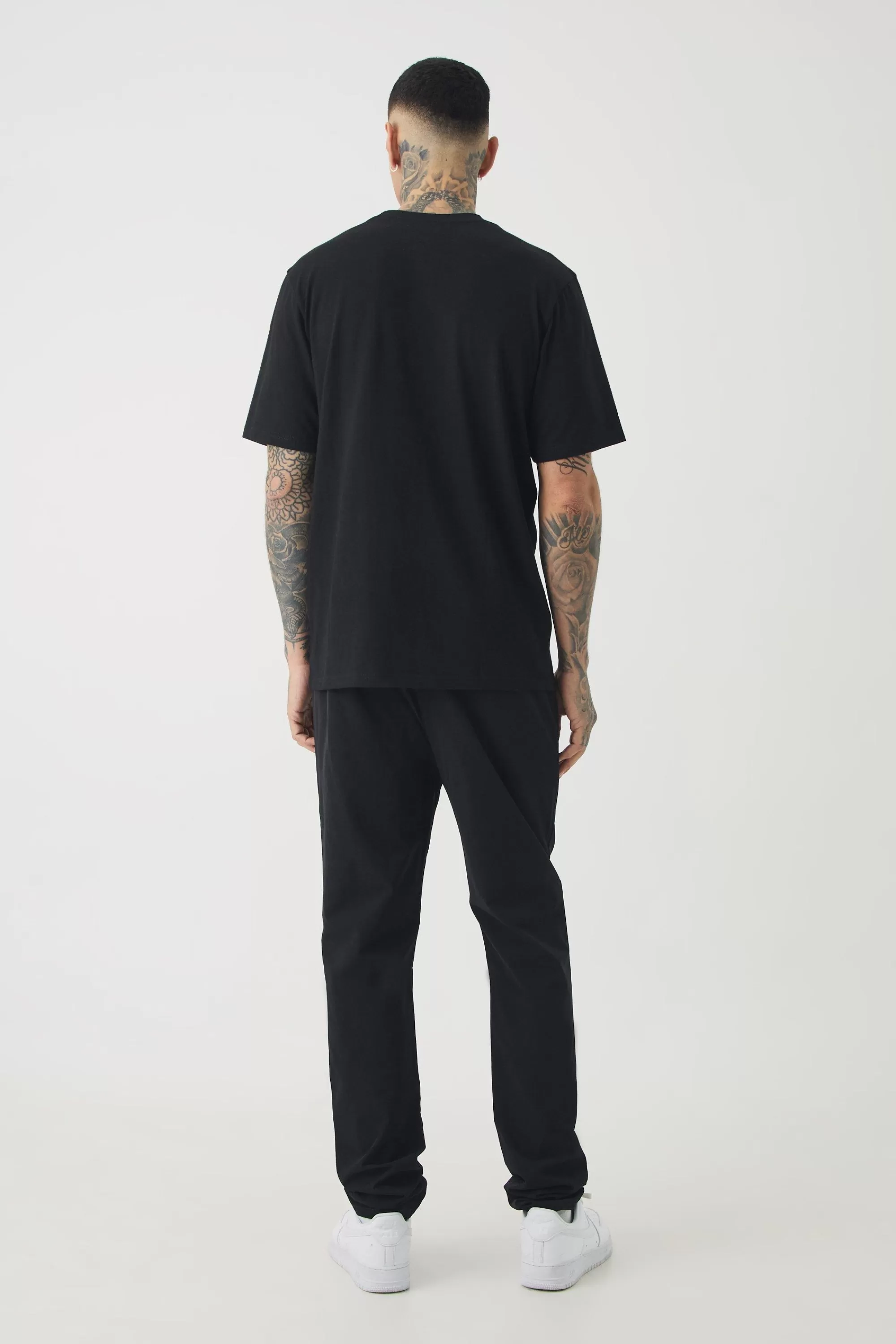 boohooMAN Tall Elasticated Waist Lightweight Technical Stretch Slim Trouser | UK