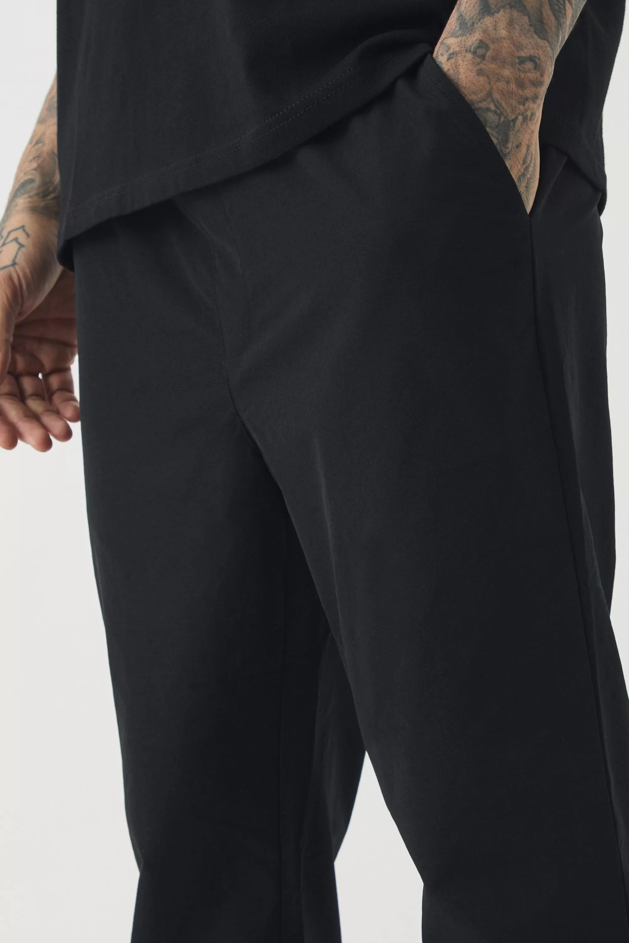 boohooMAN Tall Elasticated Waist Lightweight Technical Stretch Slim Trouser | UK