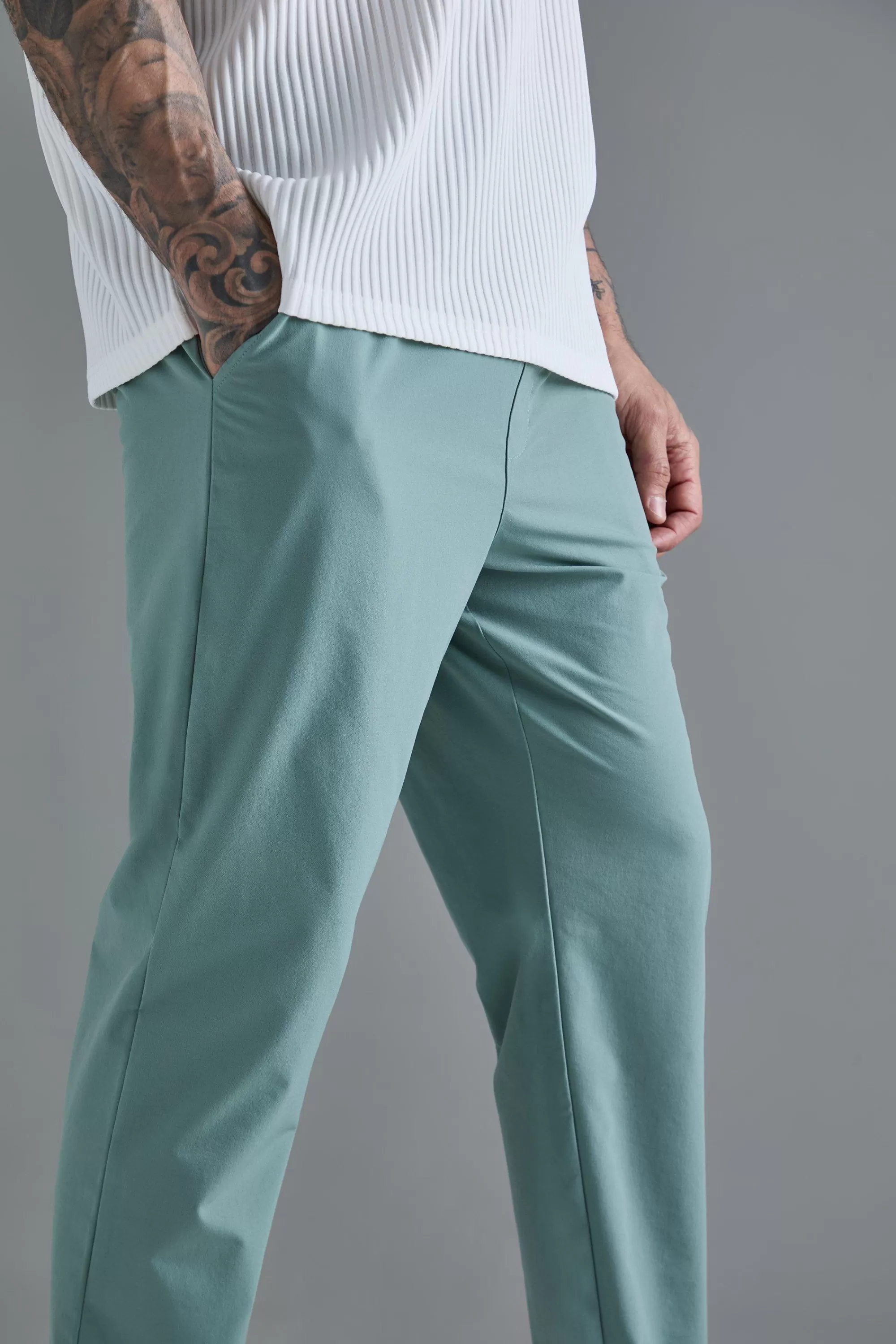 boohooMAN Tall Elasticated Waist Lightweight Technical Stretch Slim Trouser | UK