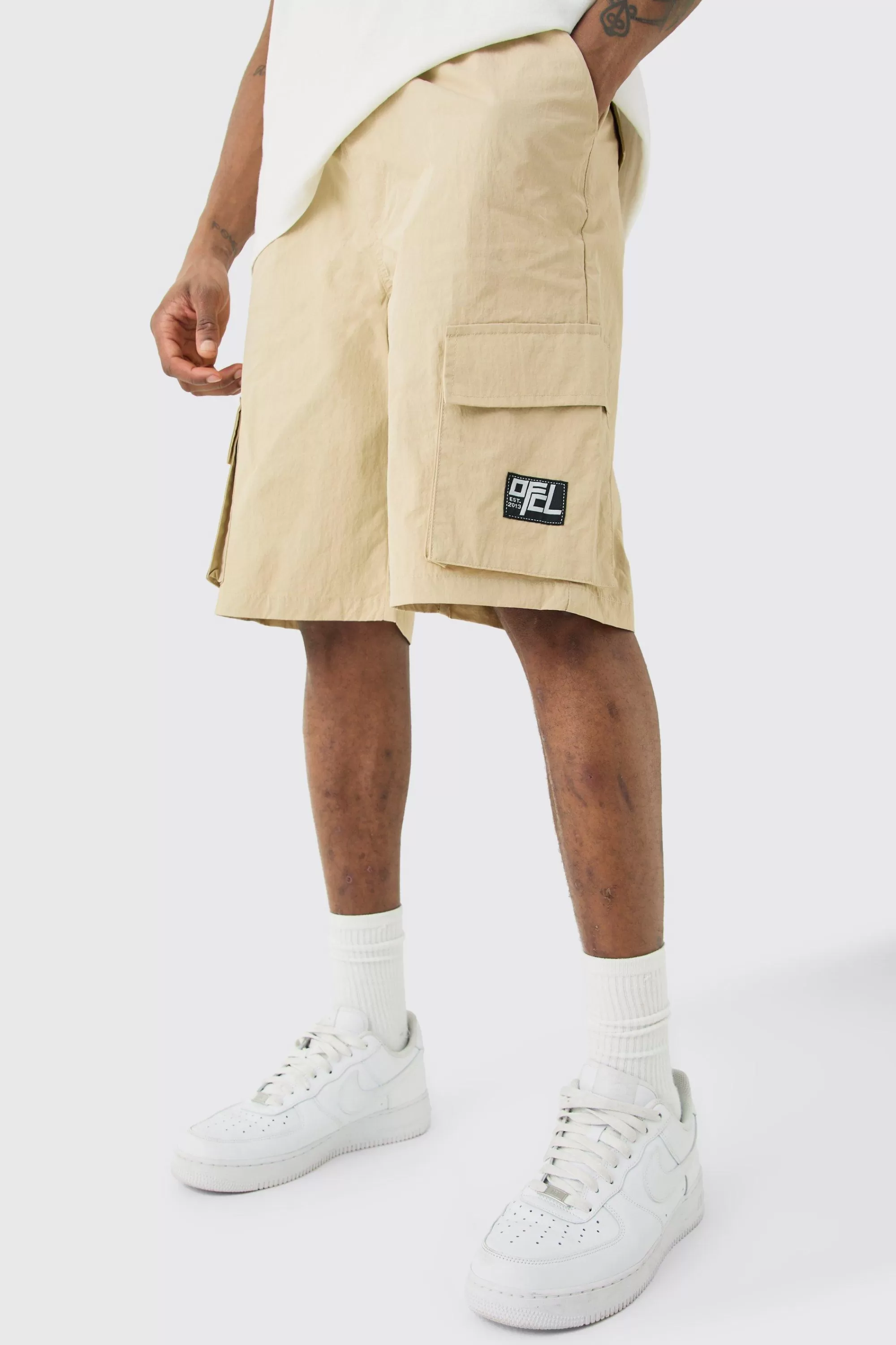 boohooMAN Tall Elasticated Waist Ofcl Nylon Cargo Short | UK