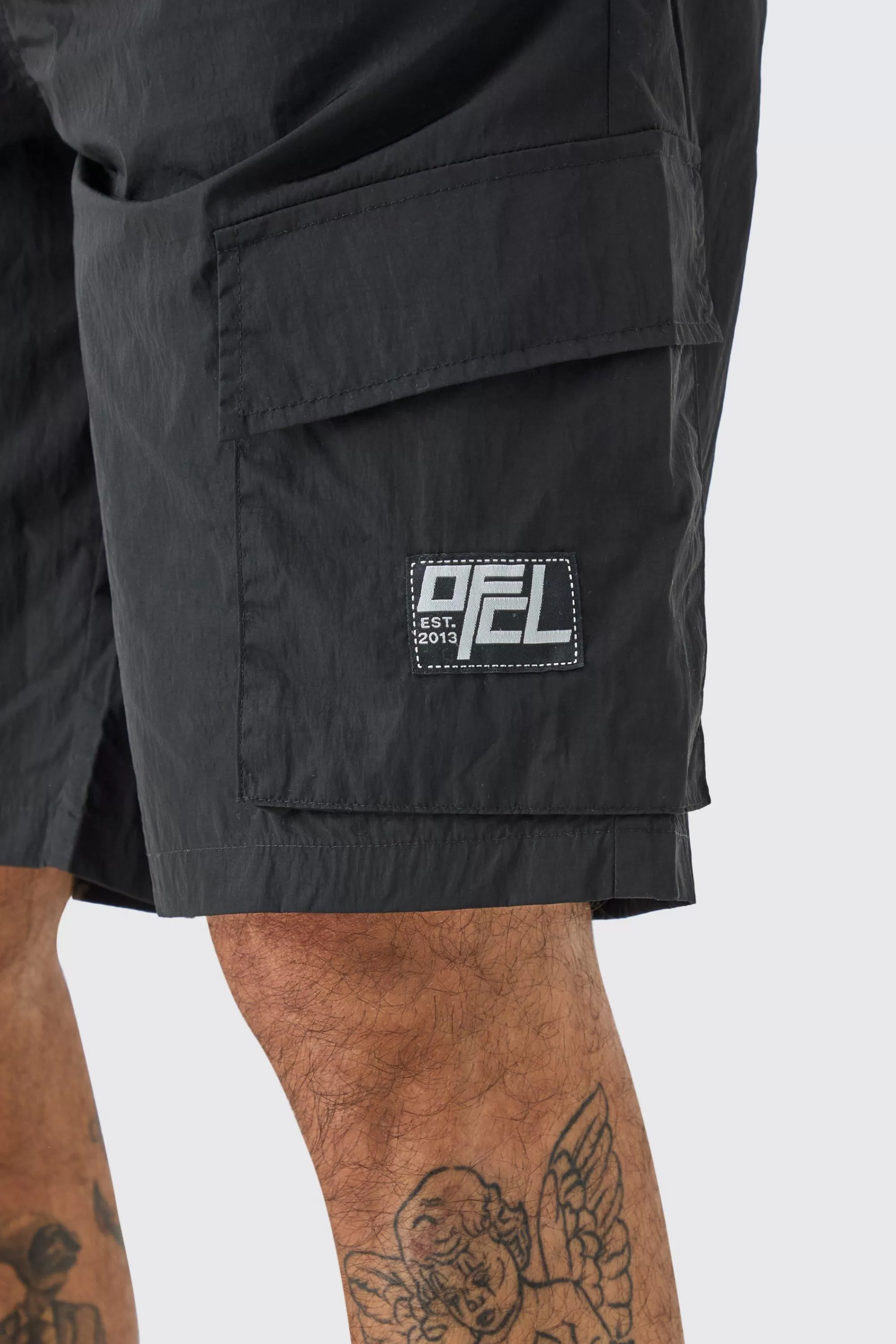 boohooMAN Tall Elasticated Waist Ofcl Nylon Cargo Short | UK