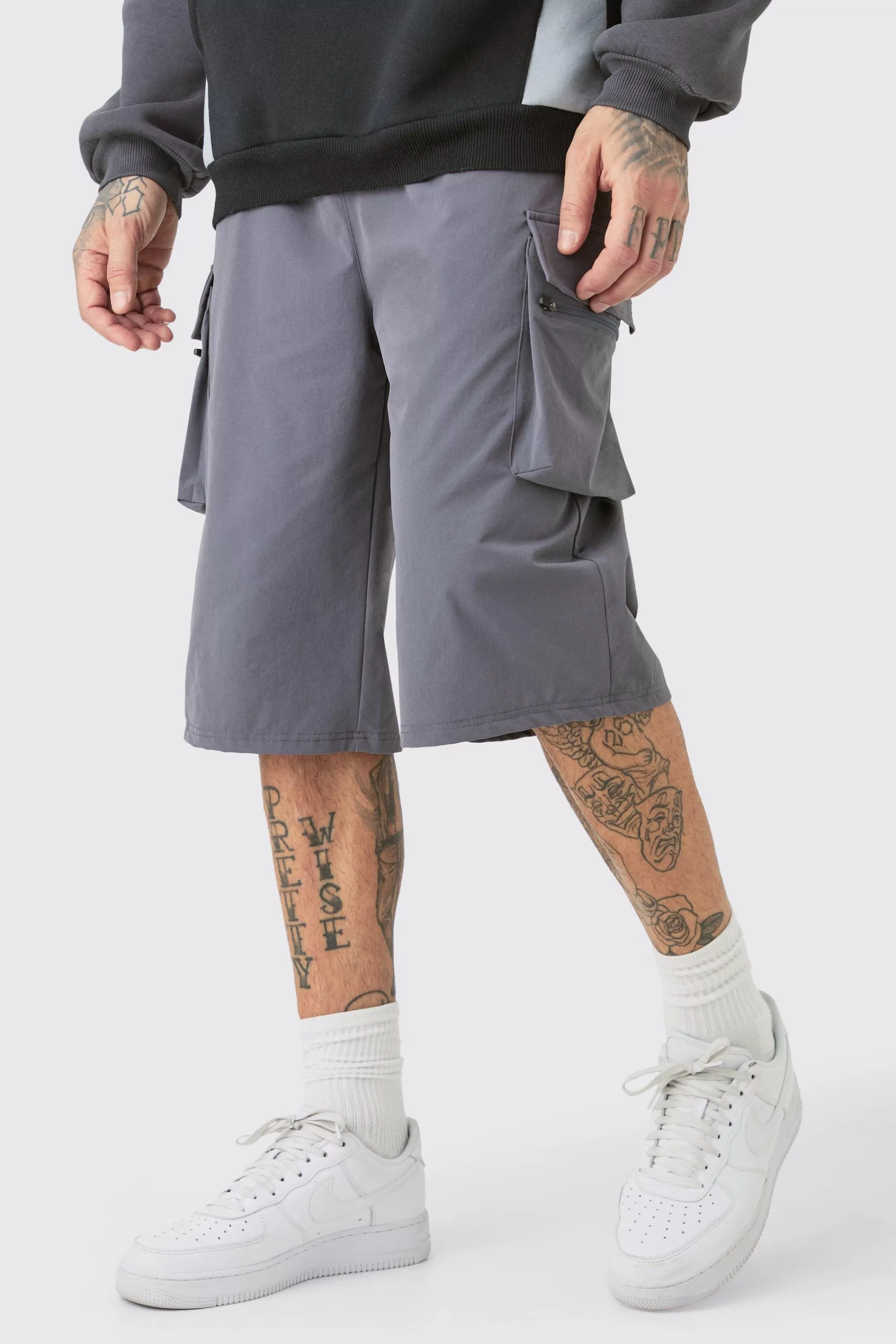 boohooMAN Tall Elasticated Waist Relaxed Lightweight Stretch Cargo Short | UK