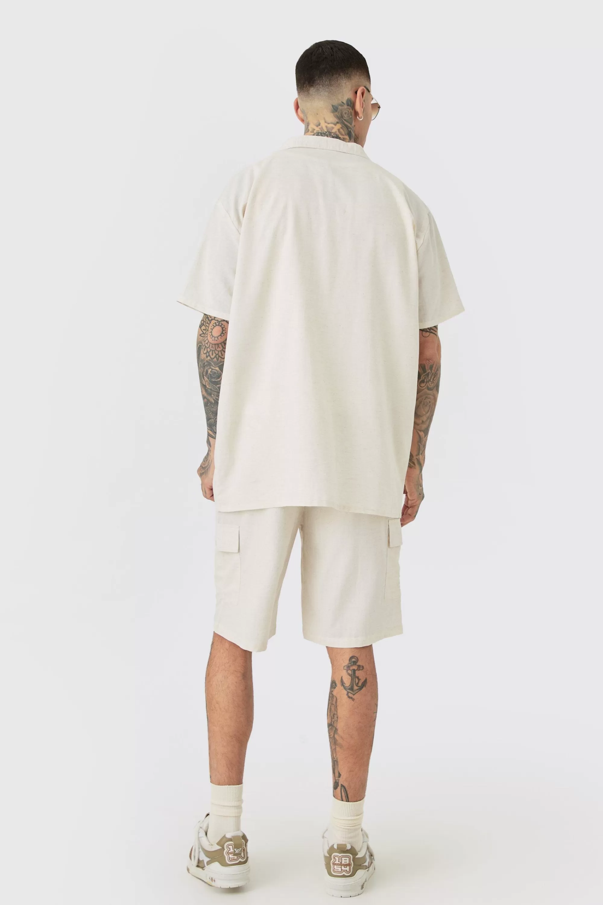 boohooMAN Tall Elasticated Waist Relaxed Linen Cargo Shorts In | UK