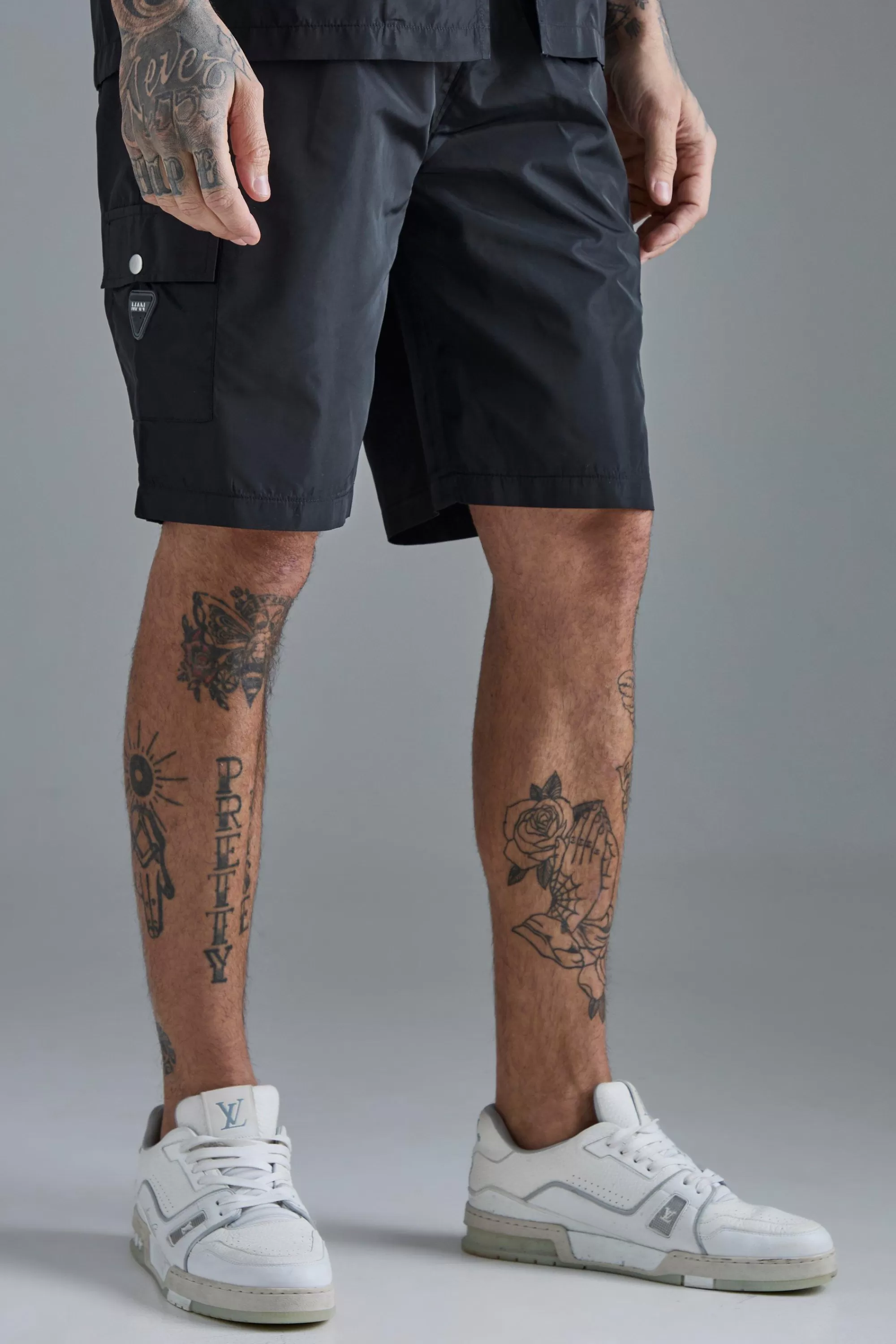 boohooMAN Tall Elasticated Waist Relaxed Nylon Man Cargo Short | UK