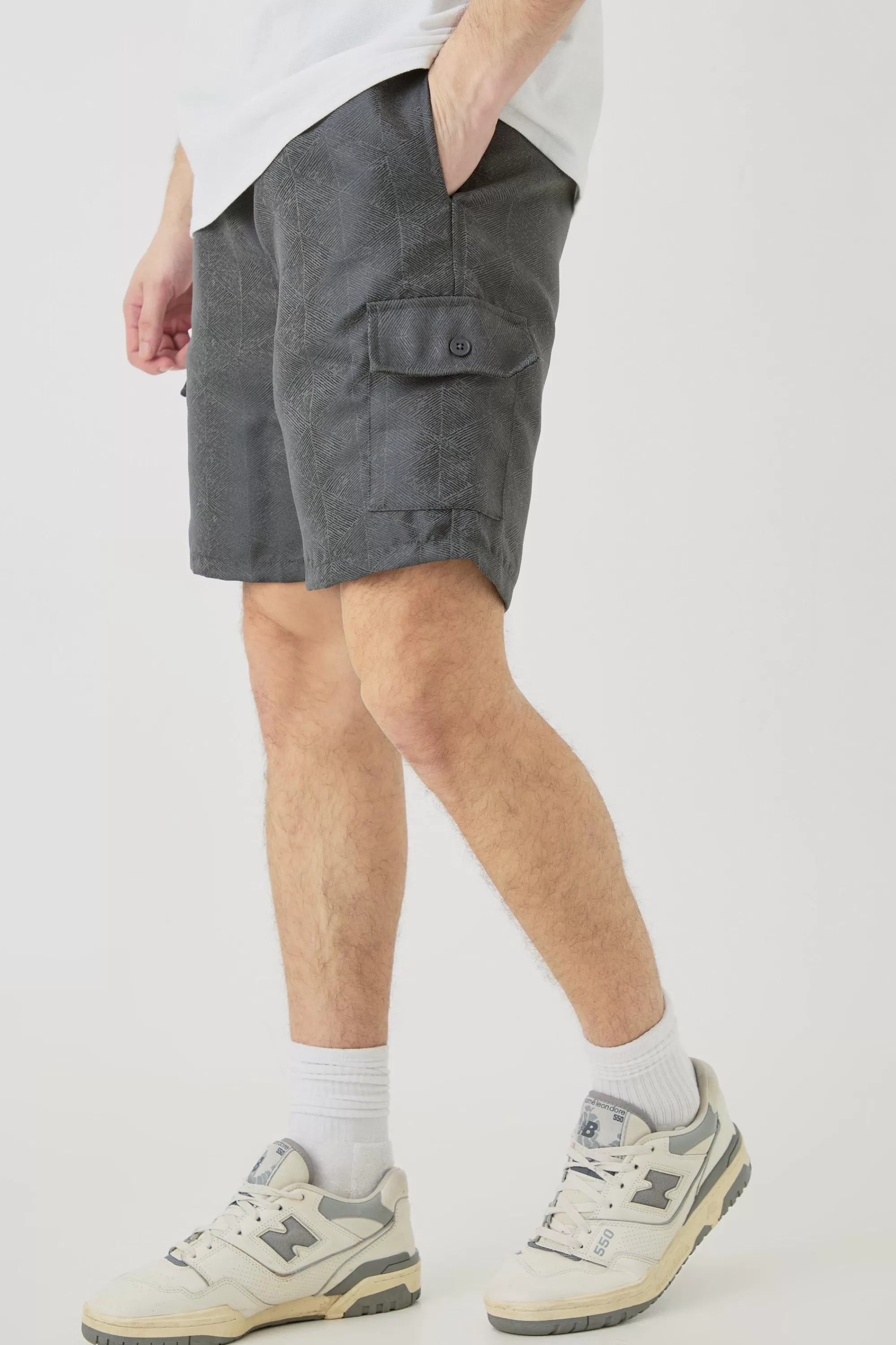 boohooMAN Tall Elasticated Waist Textured Cargo Short In | UK