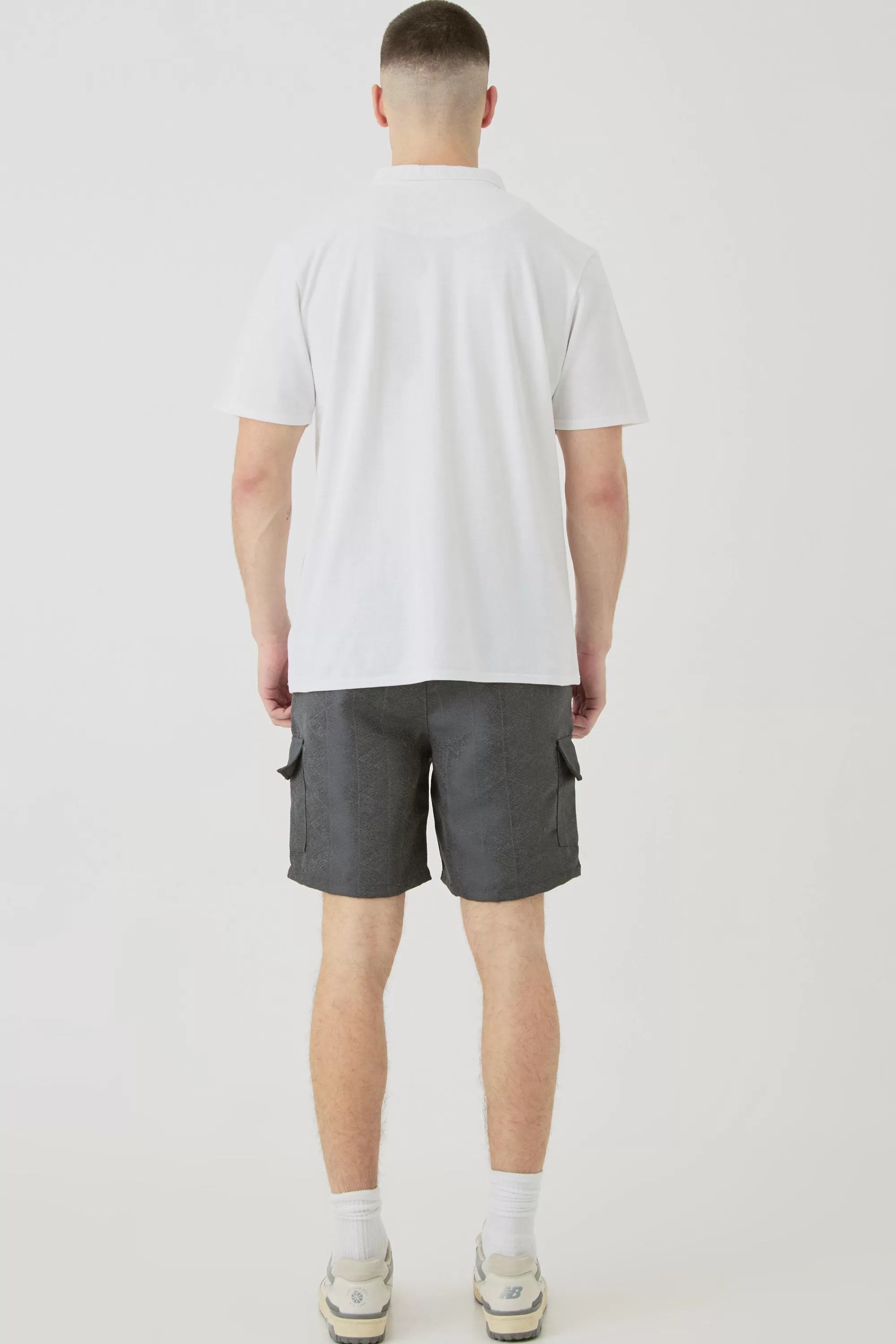 boohooMAN Tall Elasticated Waist Textured Cargo Short In | UK