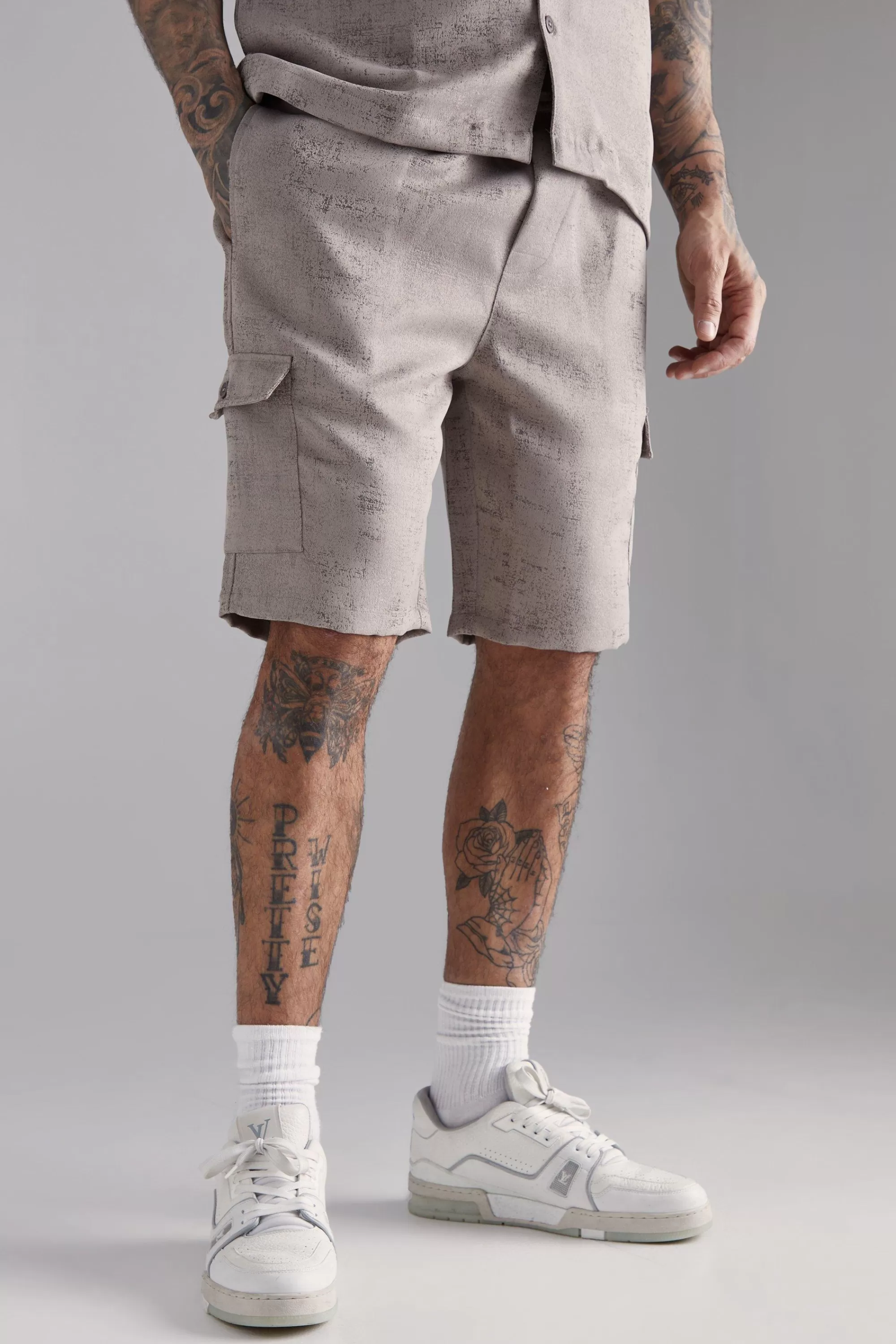 boohooMAN Tall Elasticated Waist Textured Cargo Short In | UK