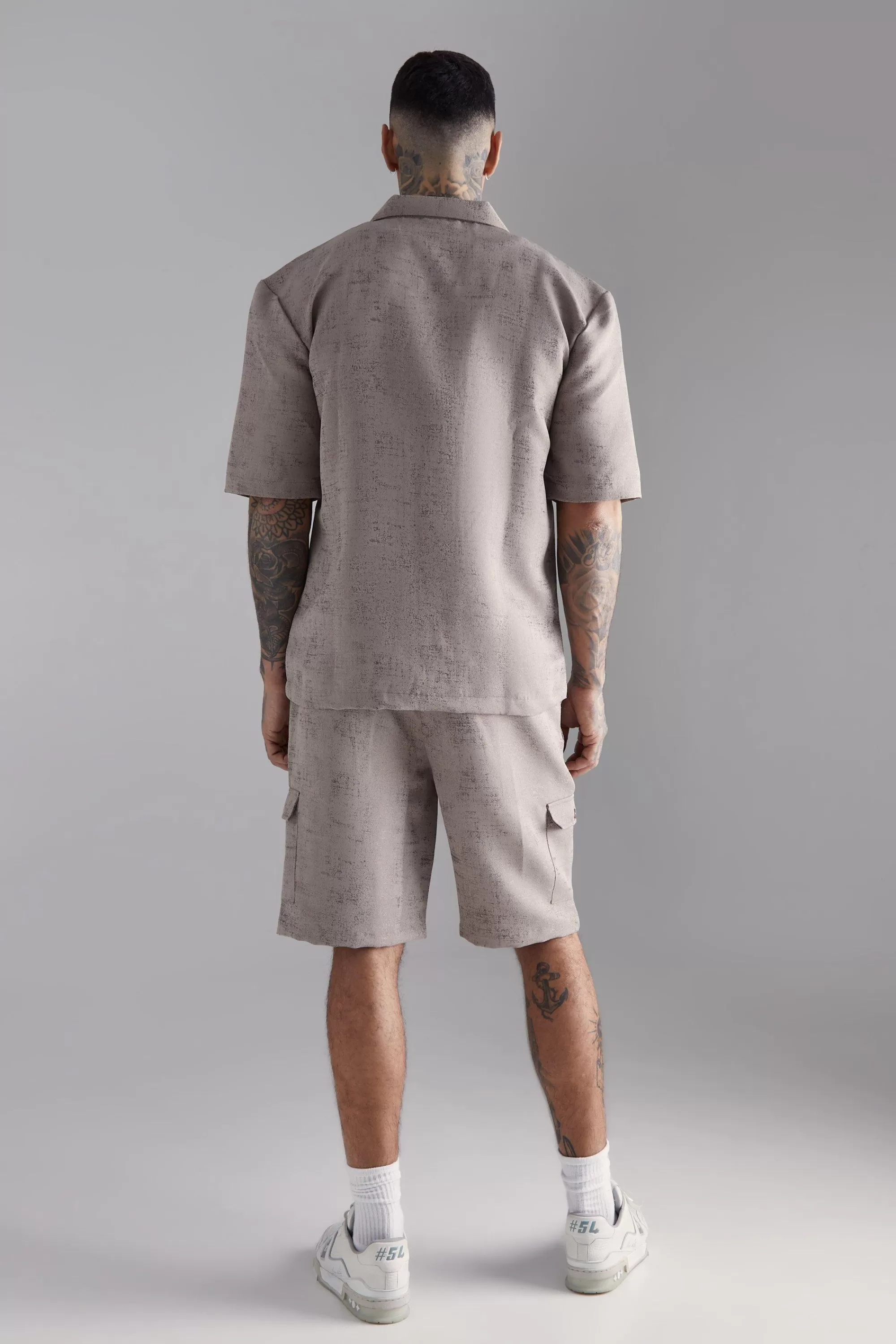 boohooMAN Tall Elasticated Waist Textured Cargo Short In | UK