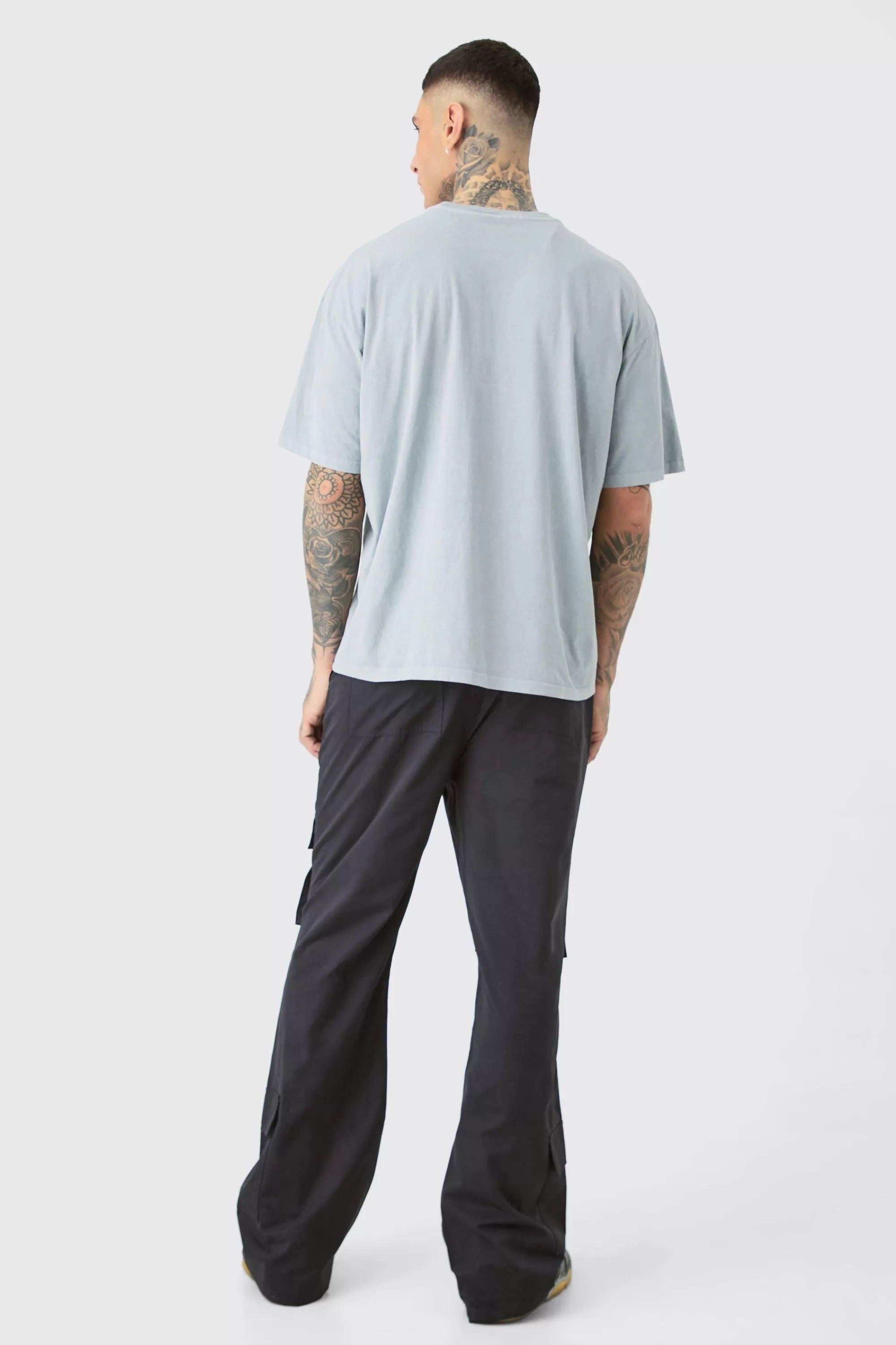 boohooMAN Tall Fixed Waist Relaxed Peached Flare Cargo Trouser | UK